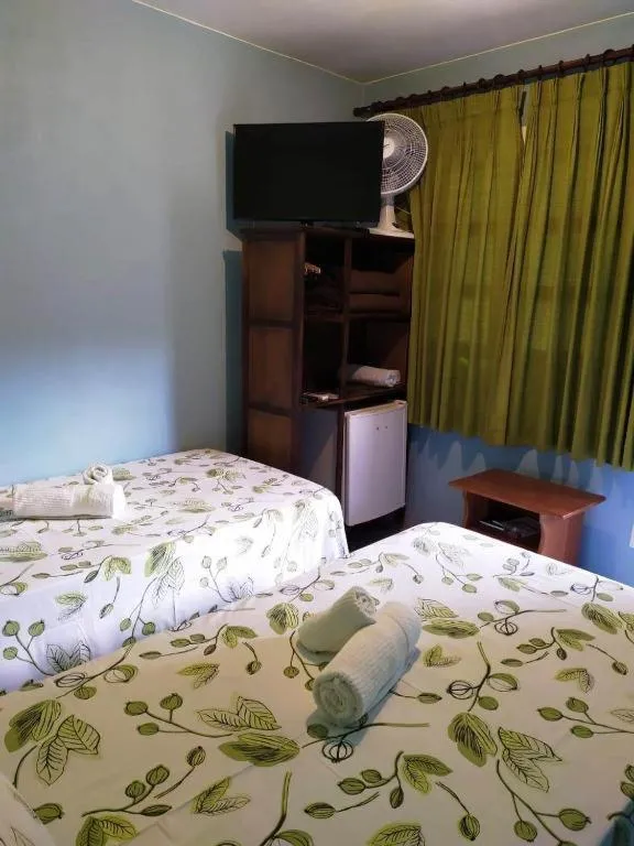 Bed in Pousada Nenzinha