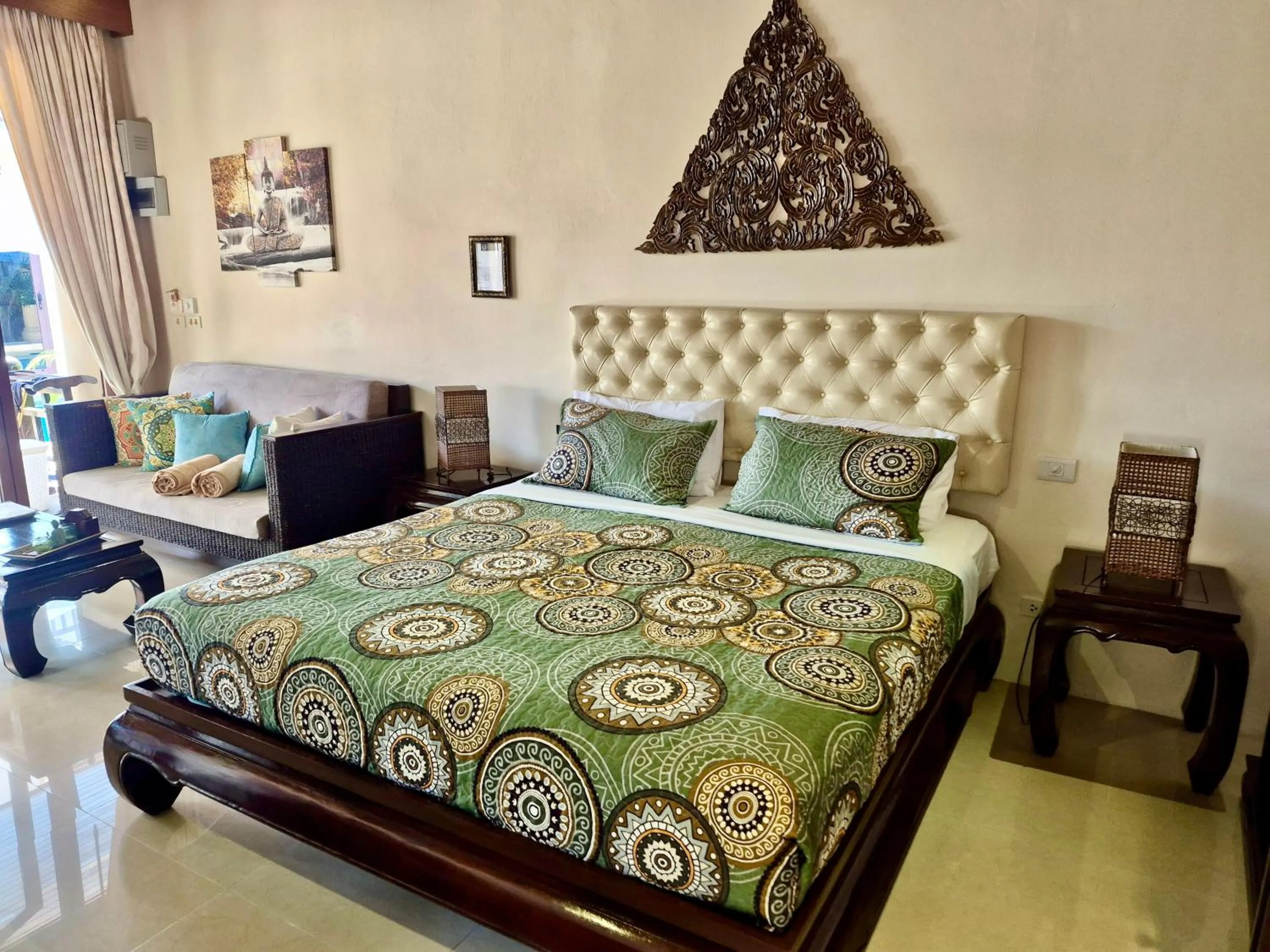 Bed in Sibaja Palms Sunset Beach Luxury Apartments