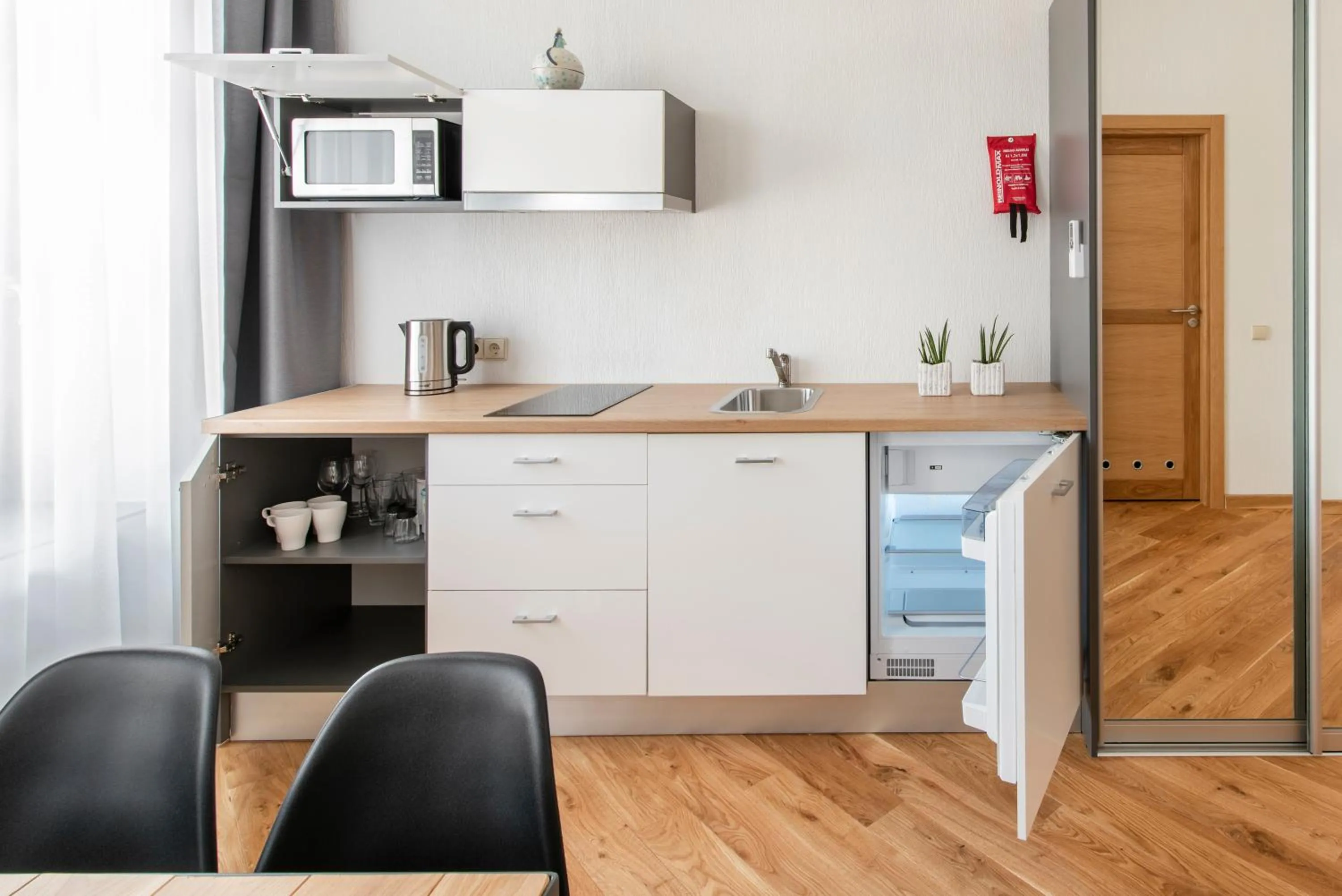 Kitchen or kitchenette in Piano Apartments