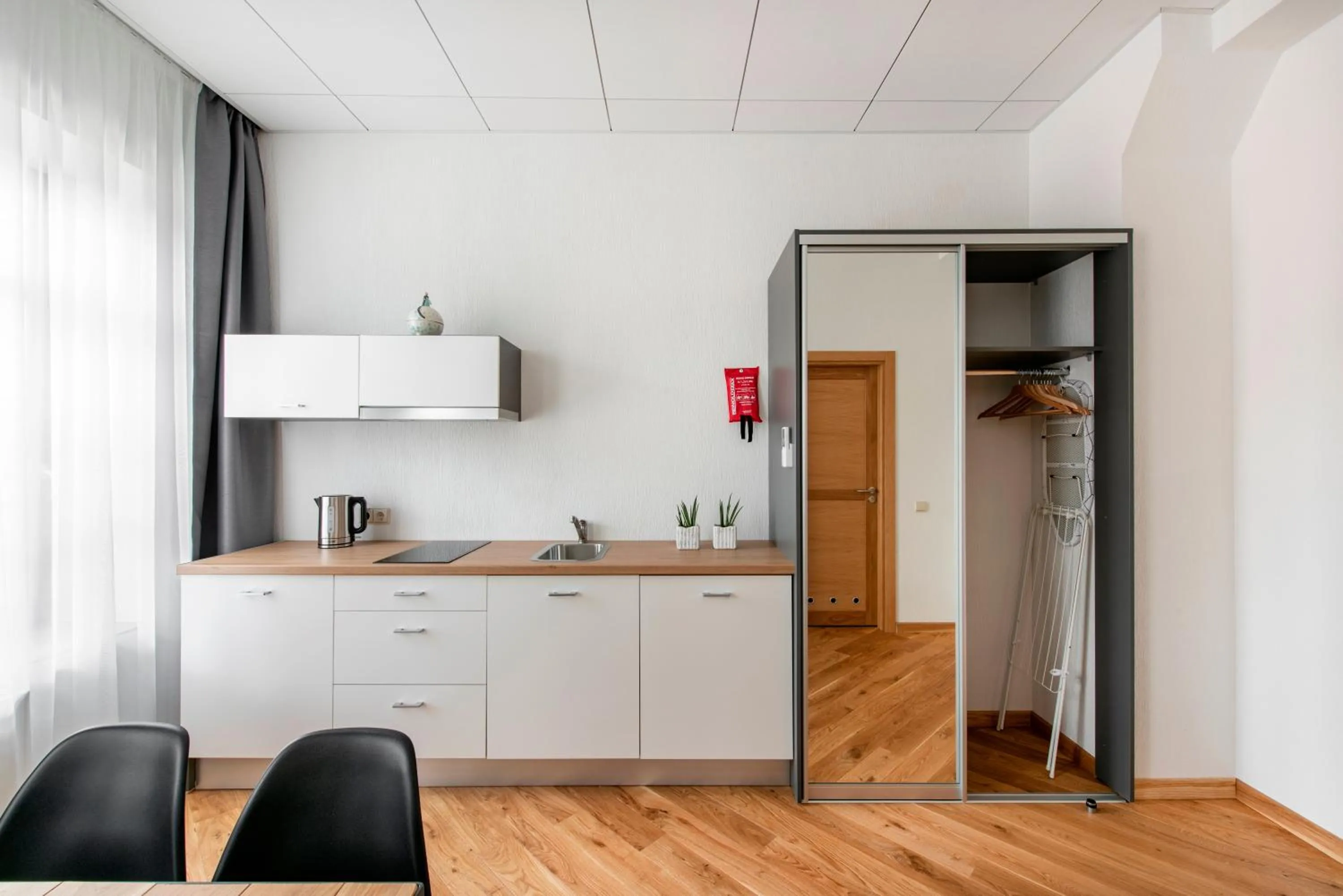 Kitchen or kitchenette in Piano Apartments