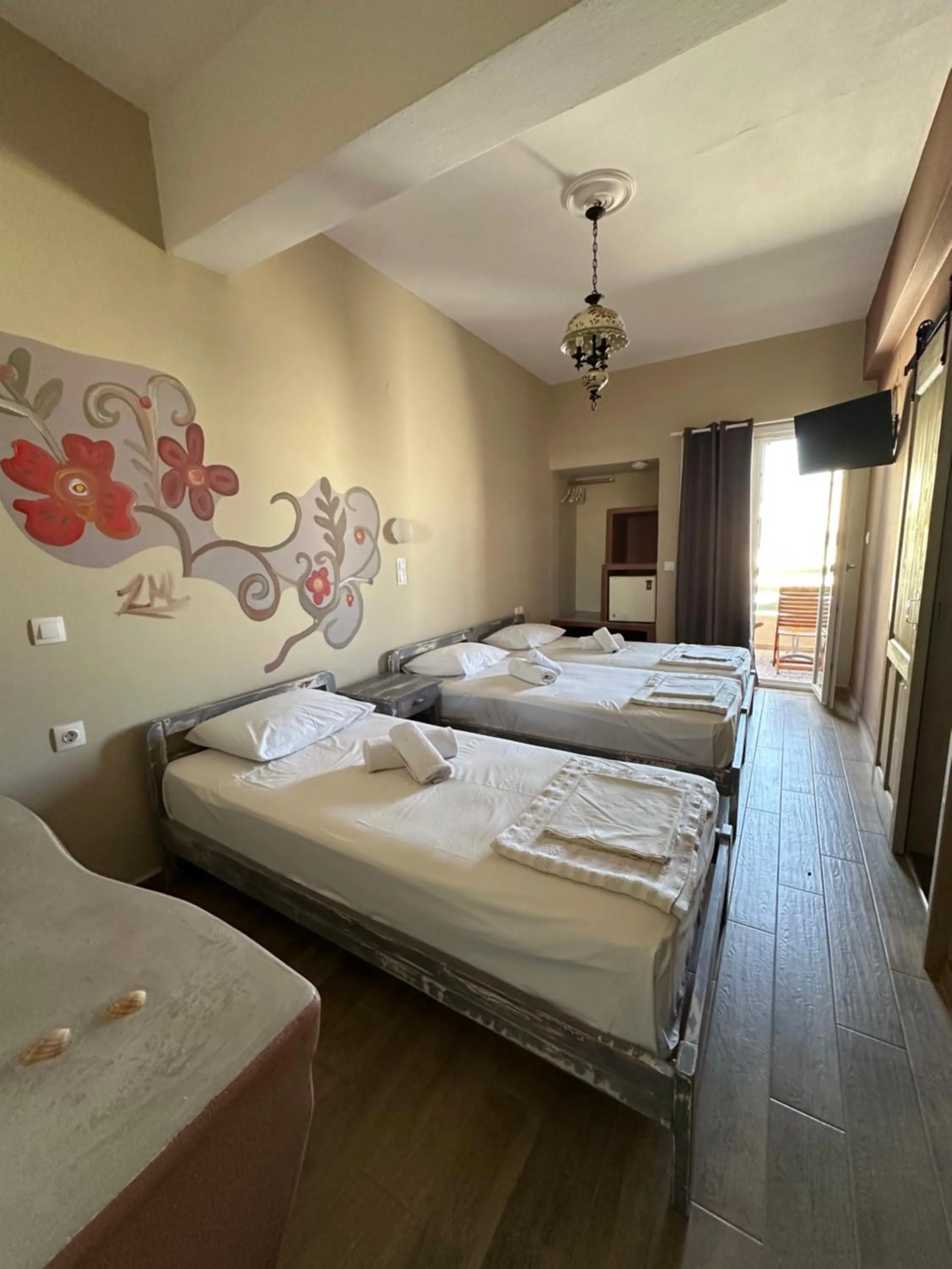 Bed in Afrodite Hotel