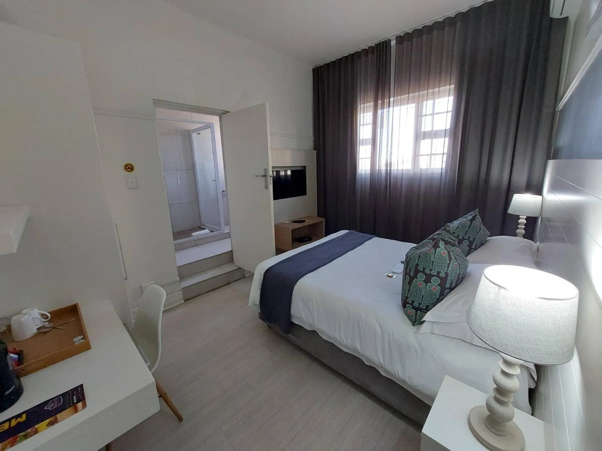 Bed in The Hampton Exclusive Guesthouse