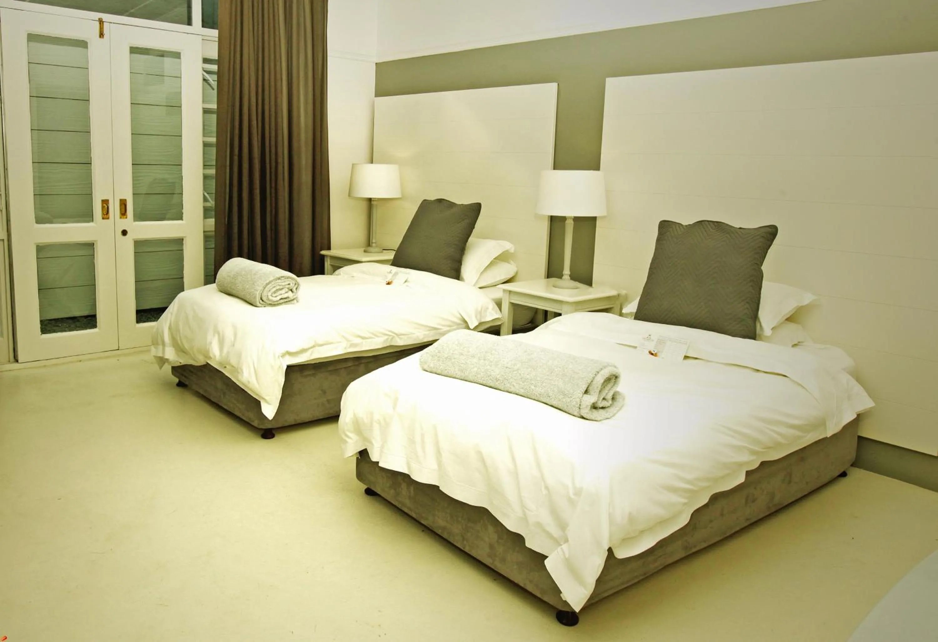 Bed in The Hampton Exclusive Guesthouse