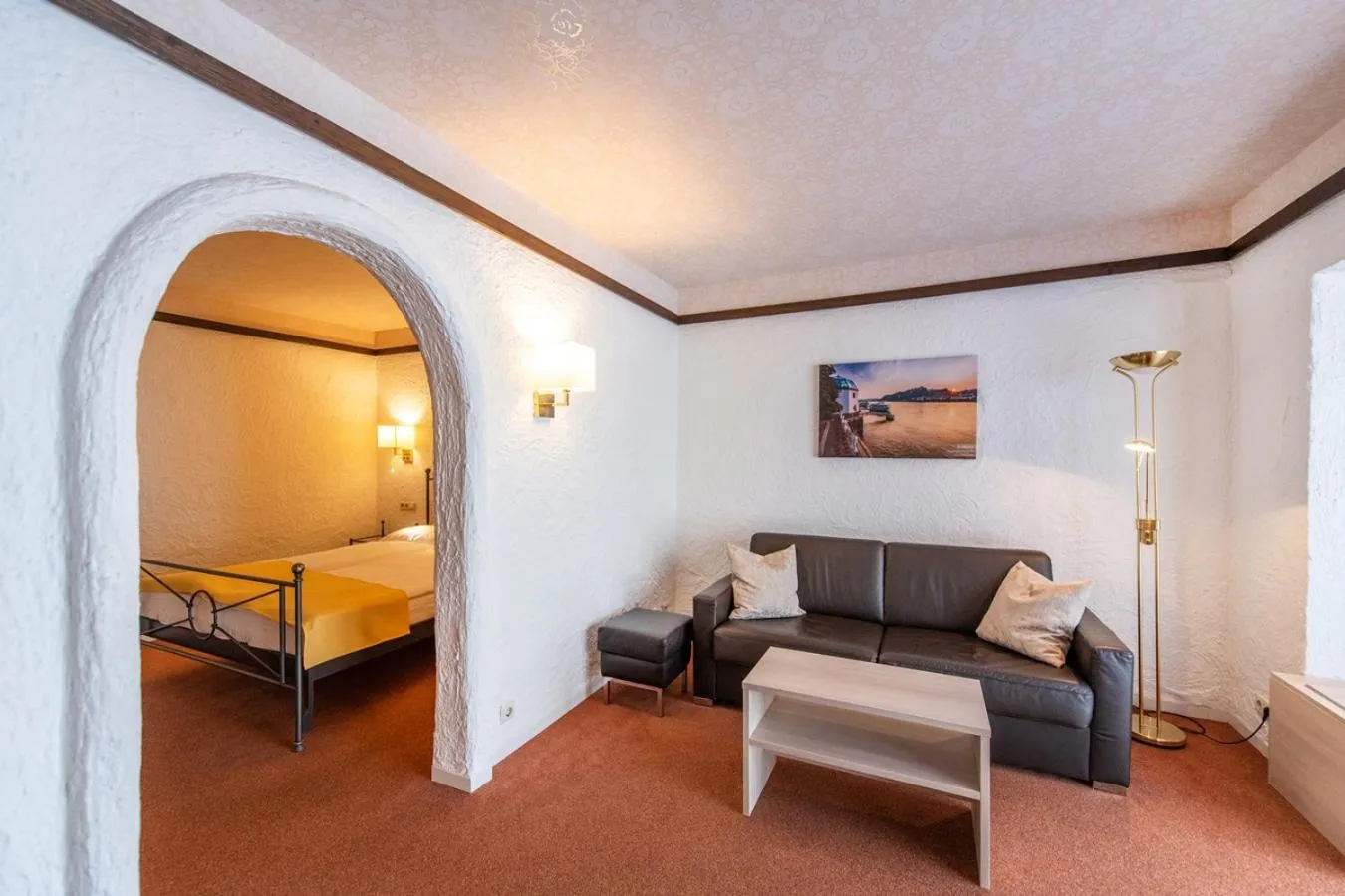 Seating area, Bed in CONTEL Hotel