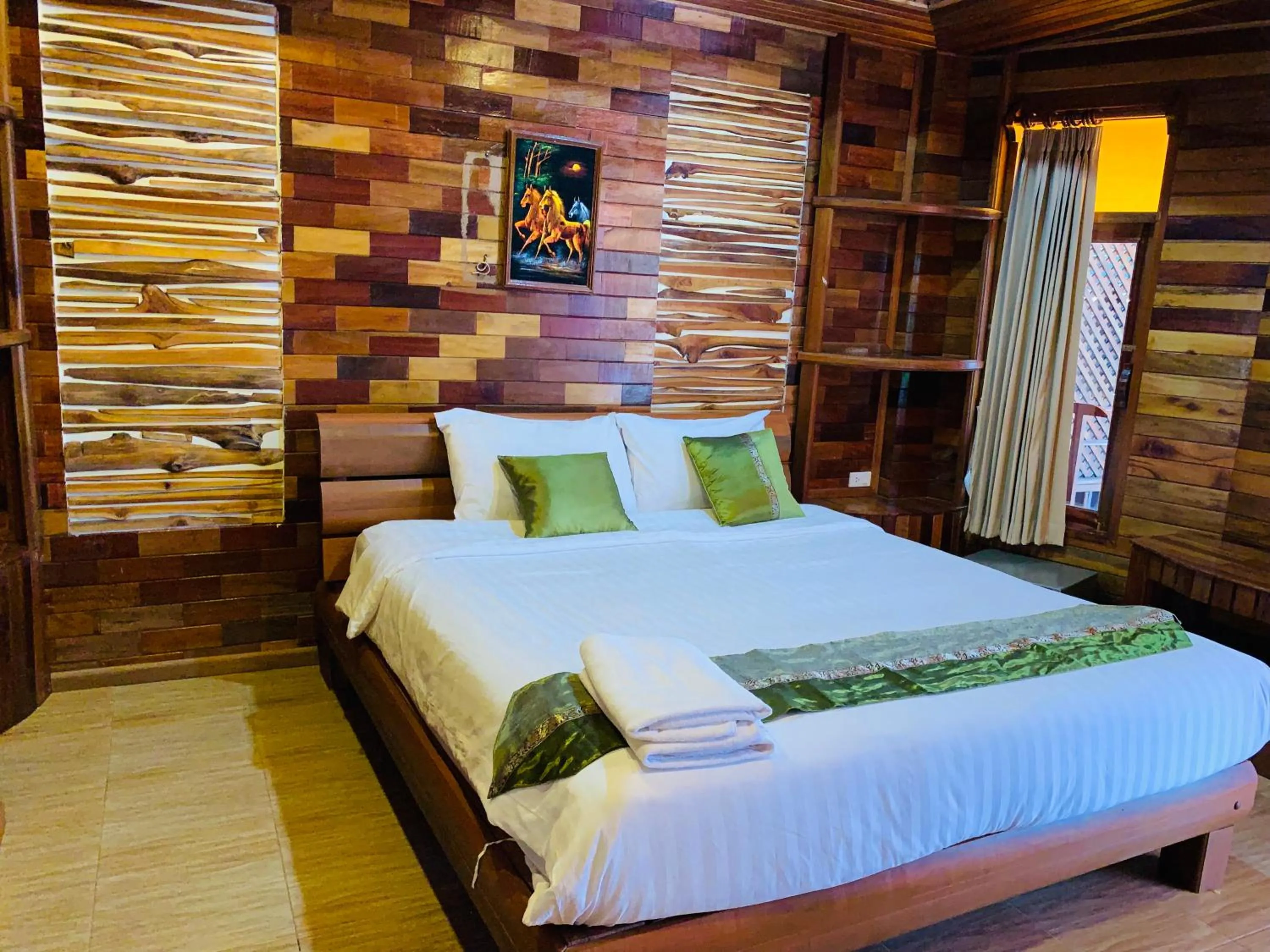 Bed in Sangsawan Palace Khaolak Resort