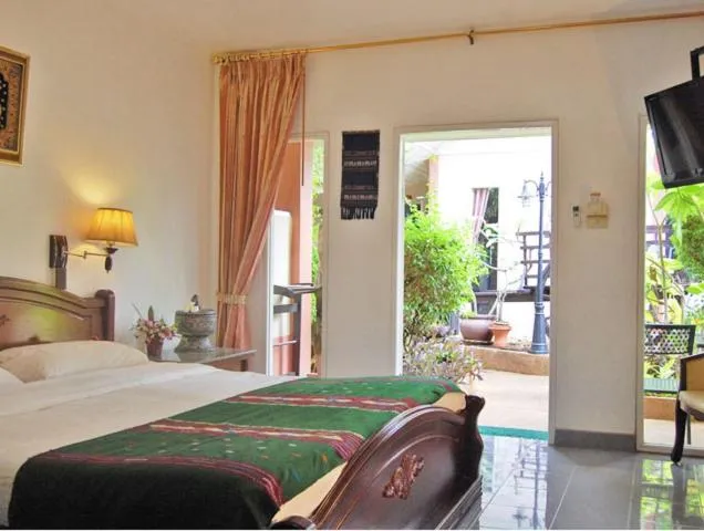 Bed in Udon Thai House Resort & Hotel