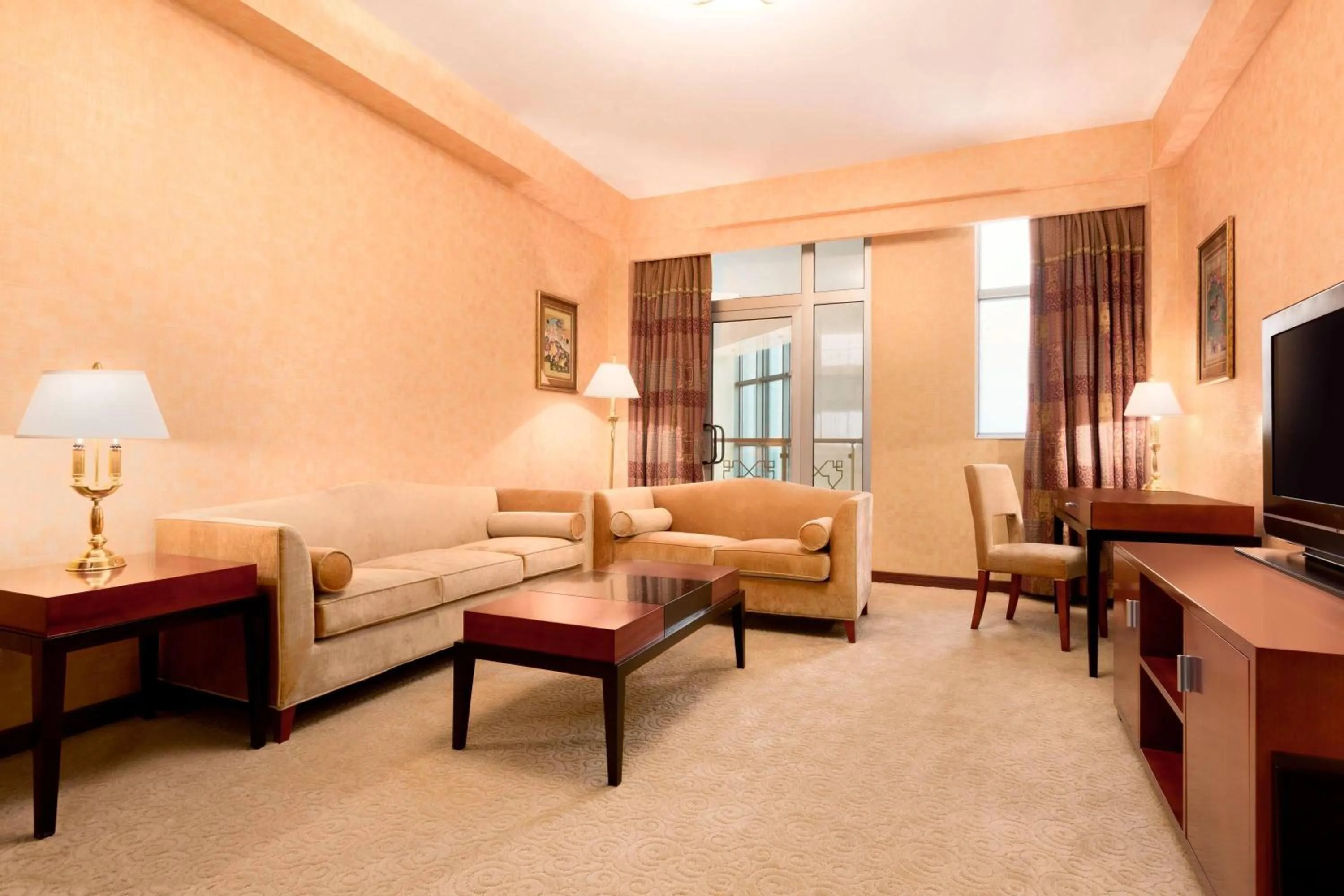 Living room in Ramada Plaza by Wyndham Gence