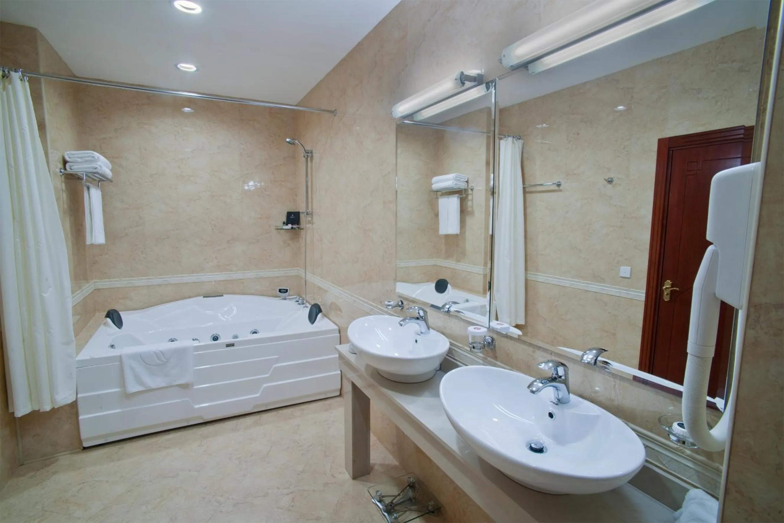 Shower in Ramada Plaza by Wyndham Gence