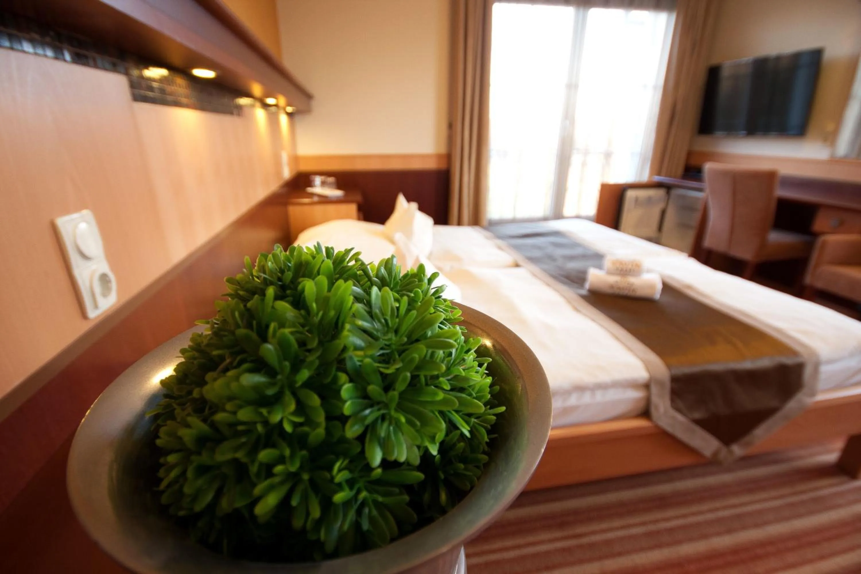 Bed in Xavin Wellness Hotel & Restaurant