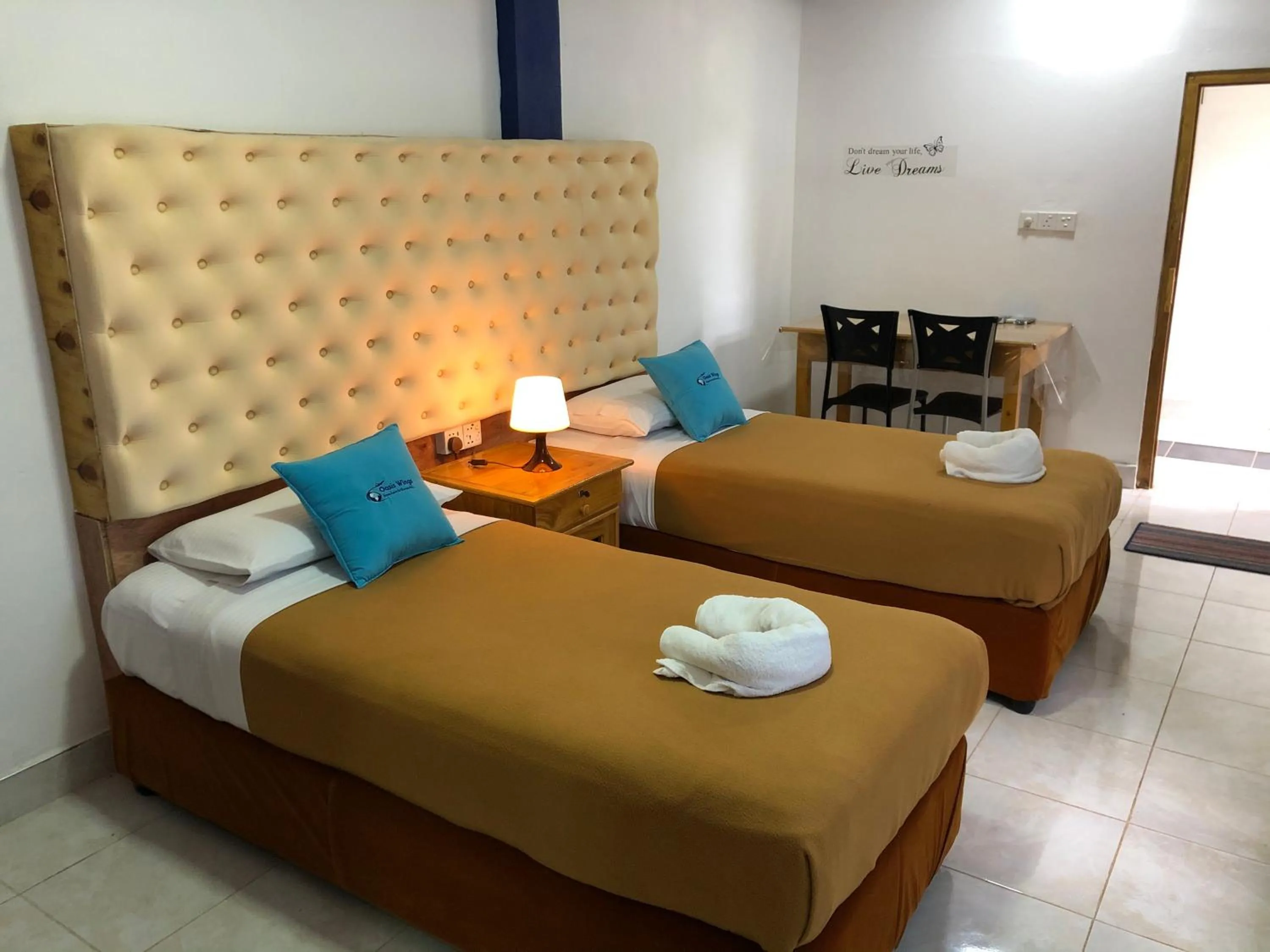Bed in Oasis Wings Hotel