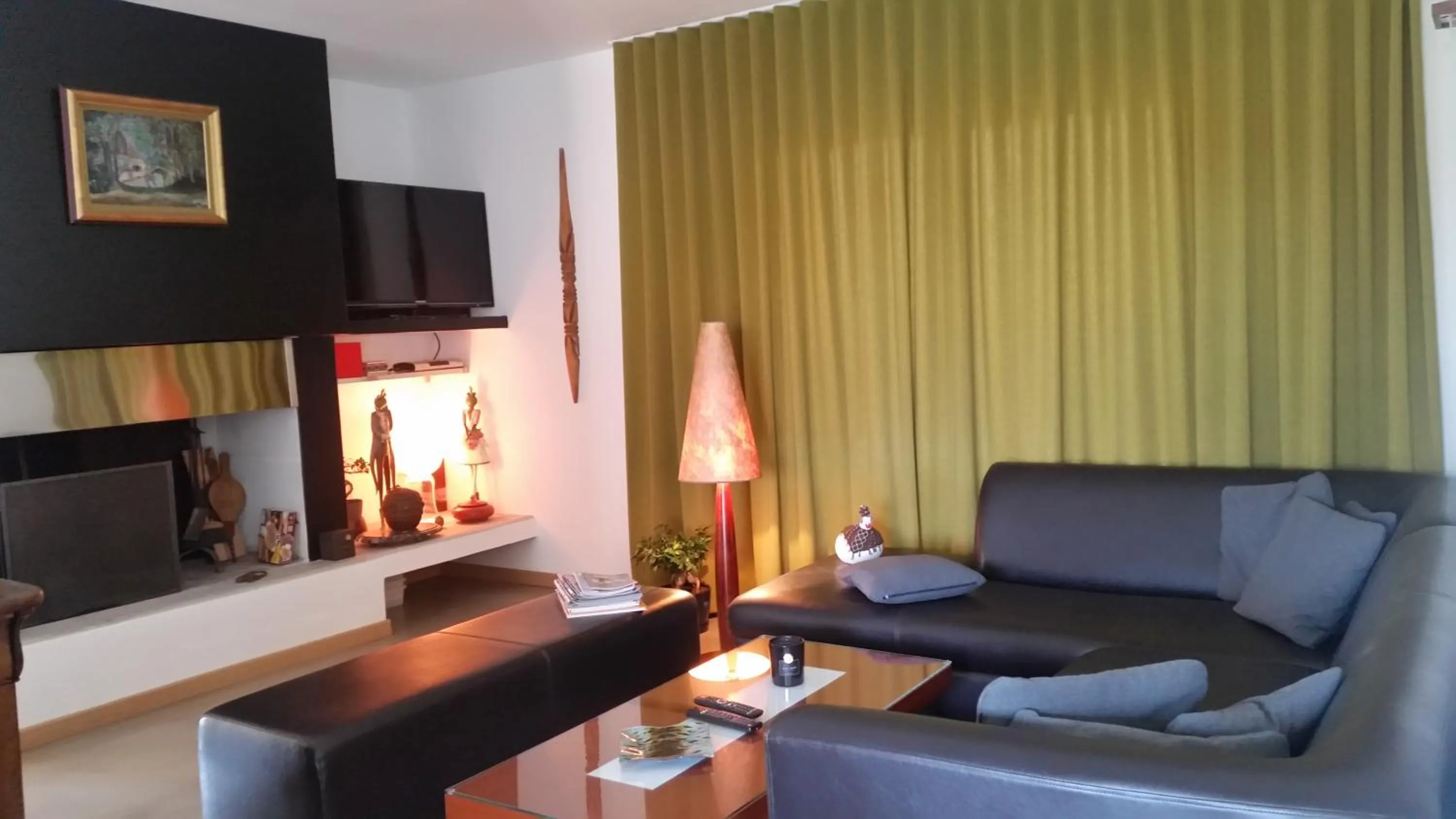 Communal lounge/ TV room in Le Jardin d'Ivana