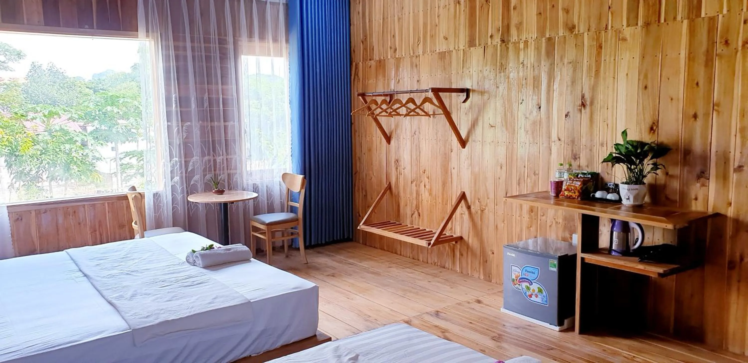 Communal lounge/ TV room, Bed in Tuyet's Homestay