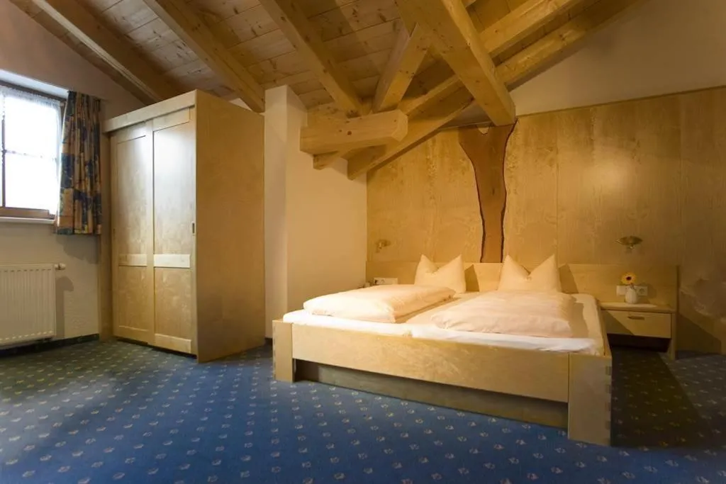 Photo of the whole room, Bed in Gasthaus Muntafuner Stöbli