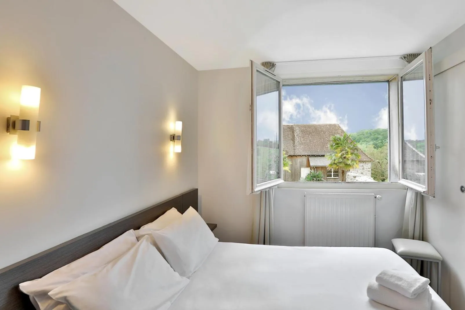 Bed in Logis Hotel Auberge Dupuytren