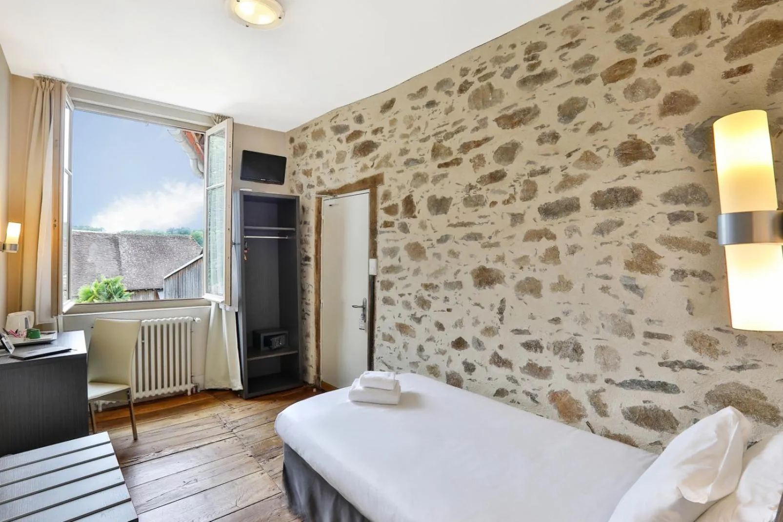 Bed in Logis Hotel Auberge Dupuytren