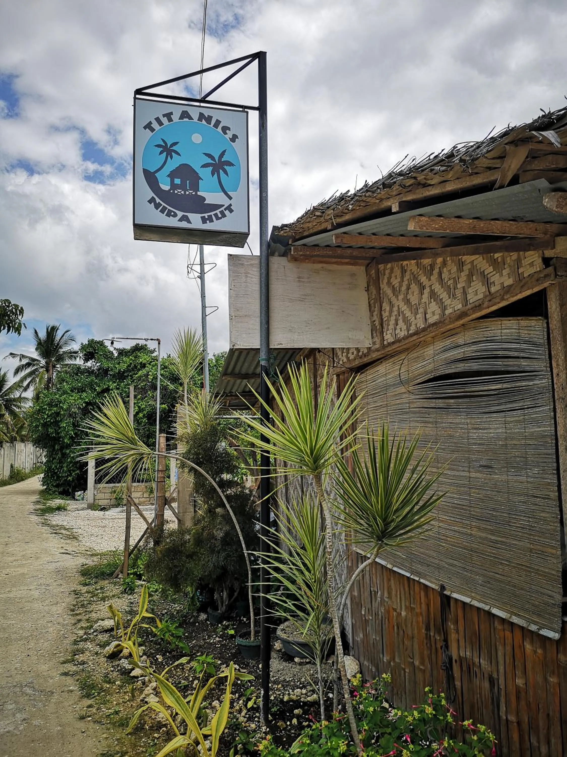 Property logo or sign in Titanic's Nipa Hut