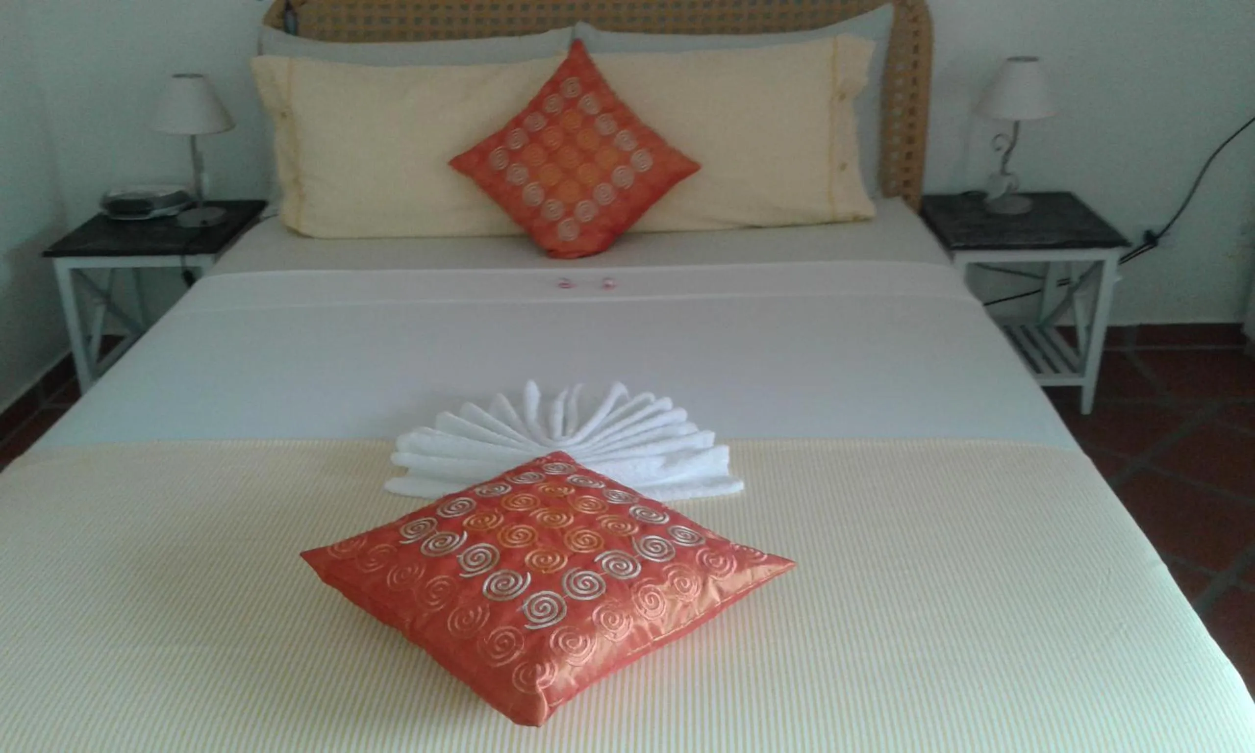 Bed in Karibu Aruba Boutique Hotel