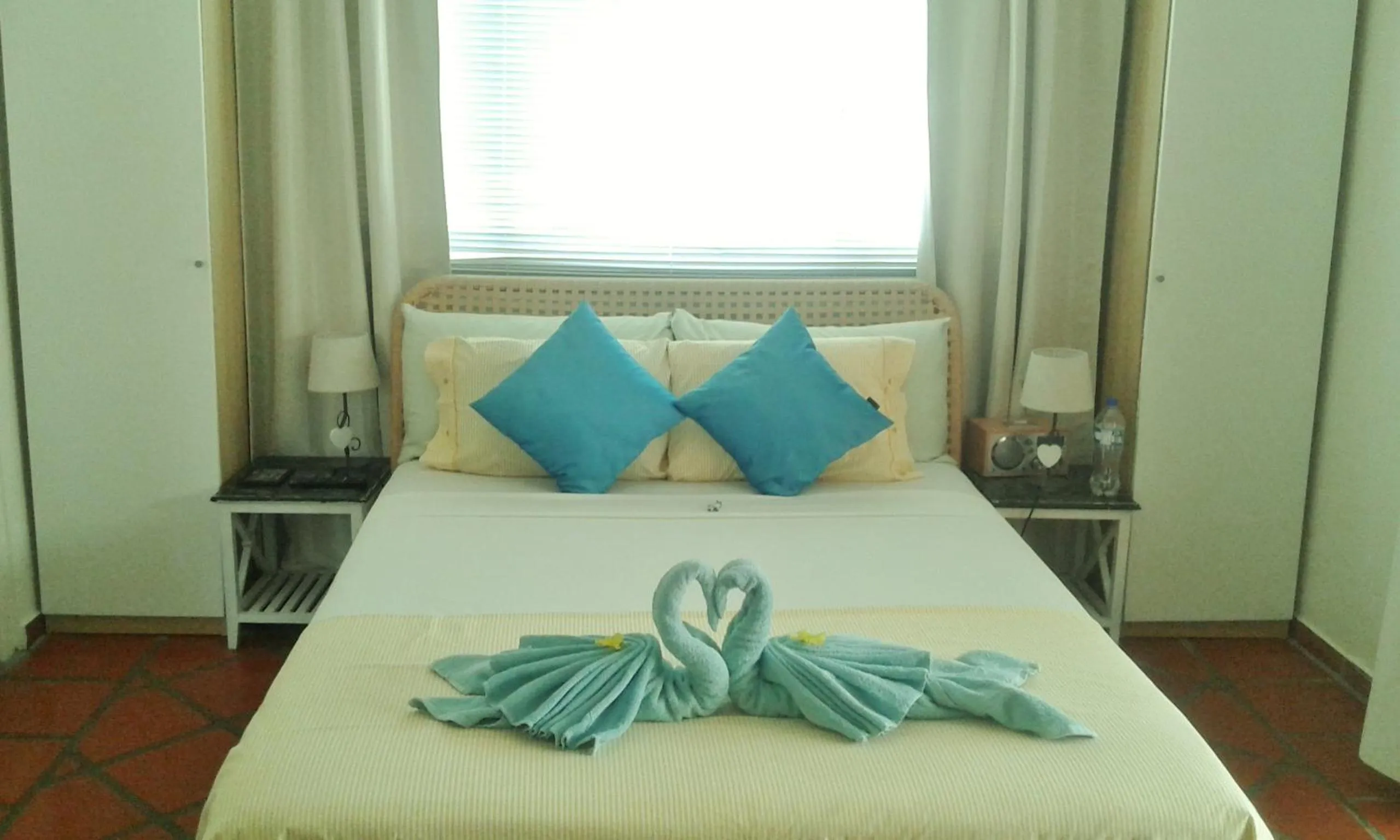 Bed in Karibu Aruba Boutique Hotel