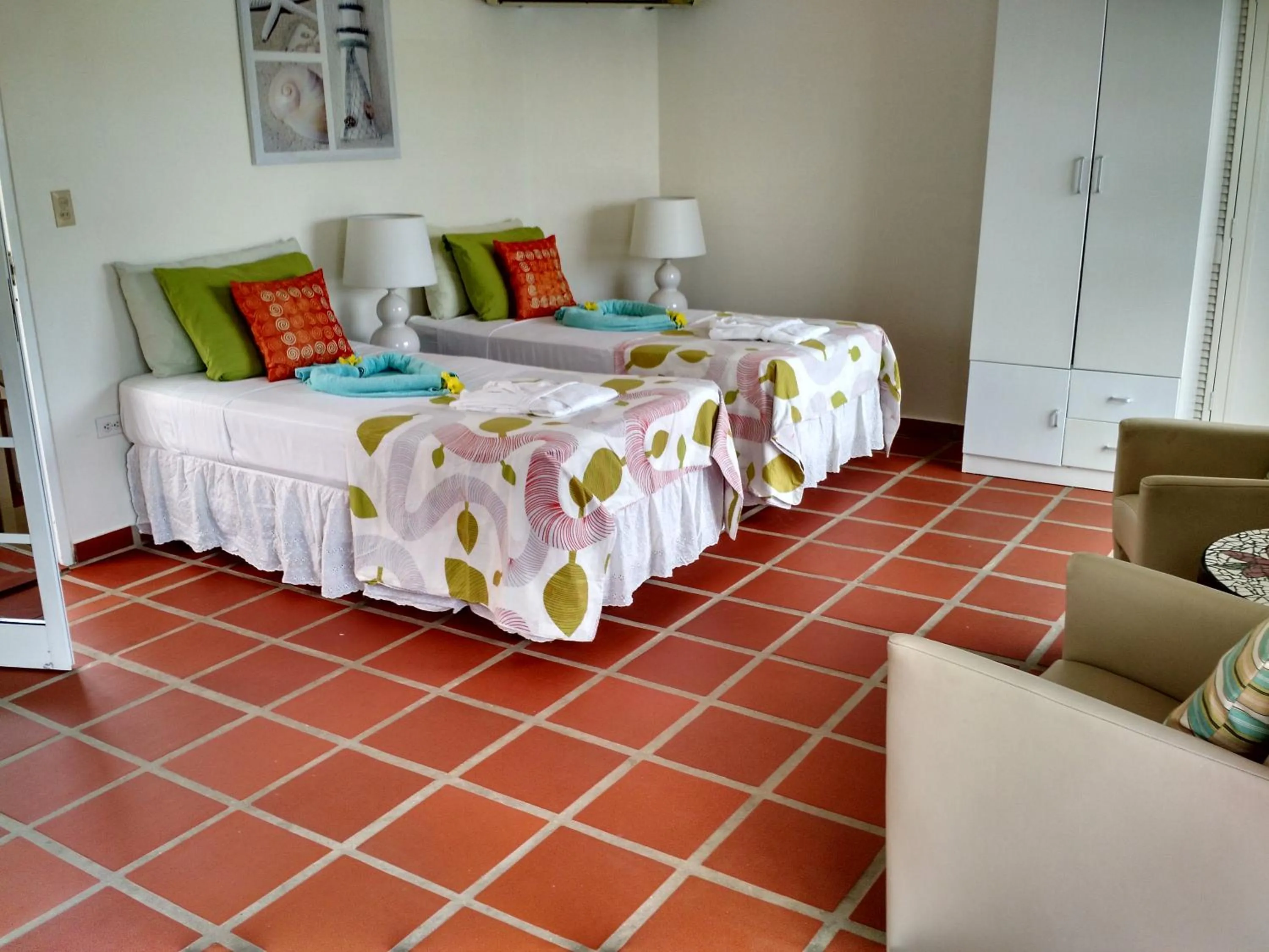 Bed in Karibu Aruba Boutique Hotel