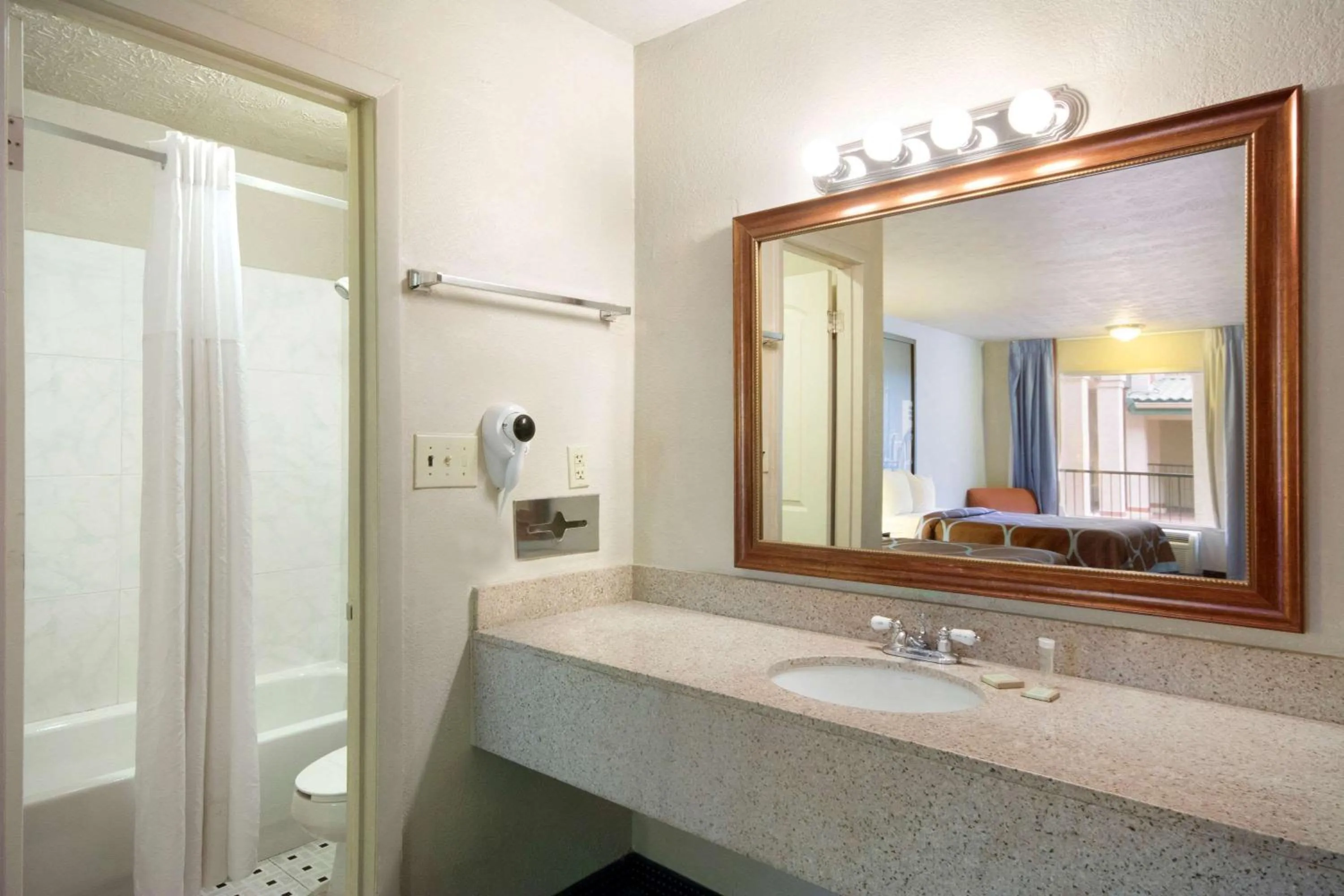Bathroom in Super 8 by Wyndham College Park/Atlanta Airport West