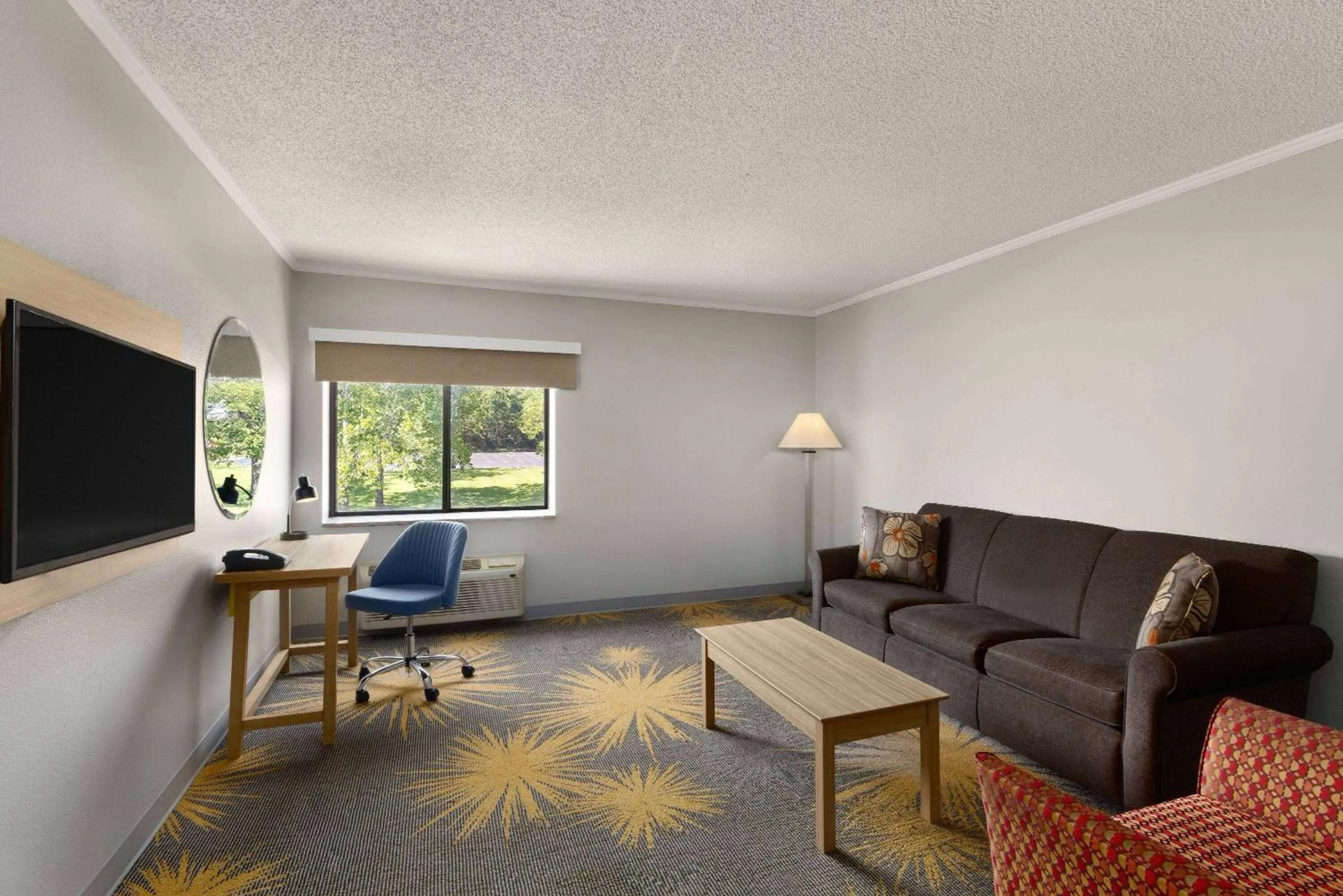 Photo of the whole room in Days Inn & Suites by Wyndham Kansas City - CHIEFS Stadium