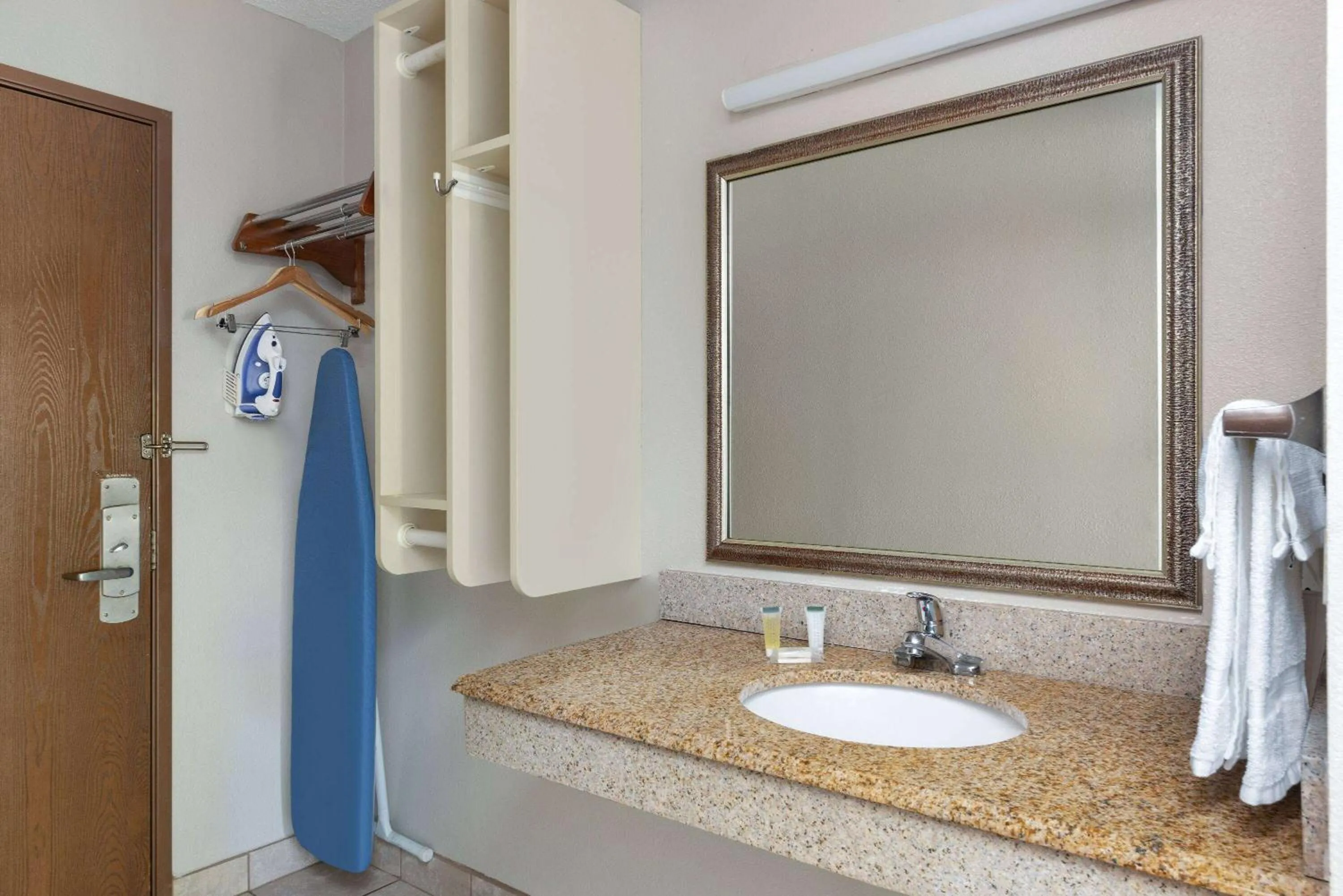 Bathroom in Days Inn & Suites by Wyndham Kansas City - CHIEFS Stadium