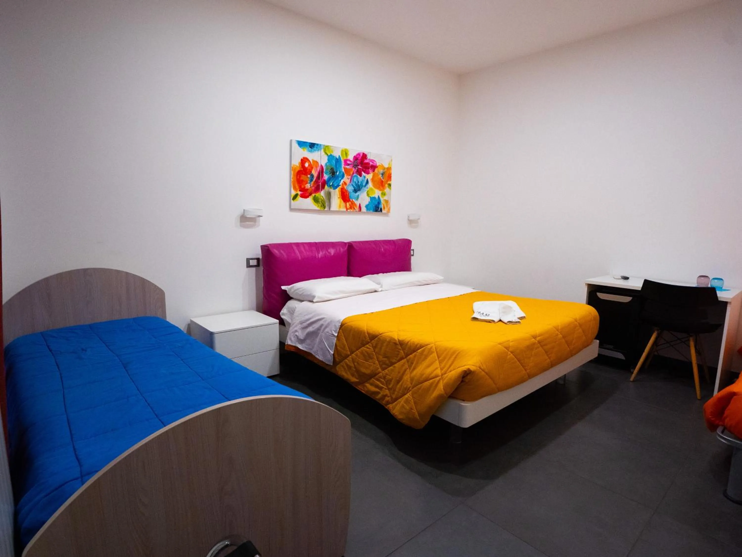 Bed in Amuri Room&Suite