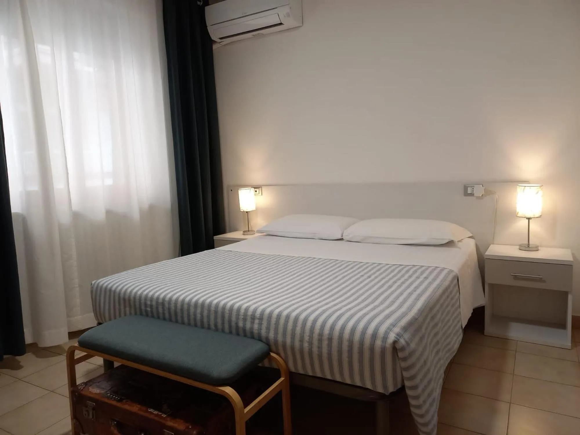 Bed in Hotel Cormorano