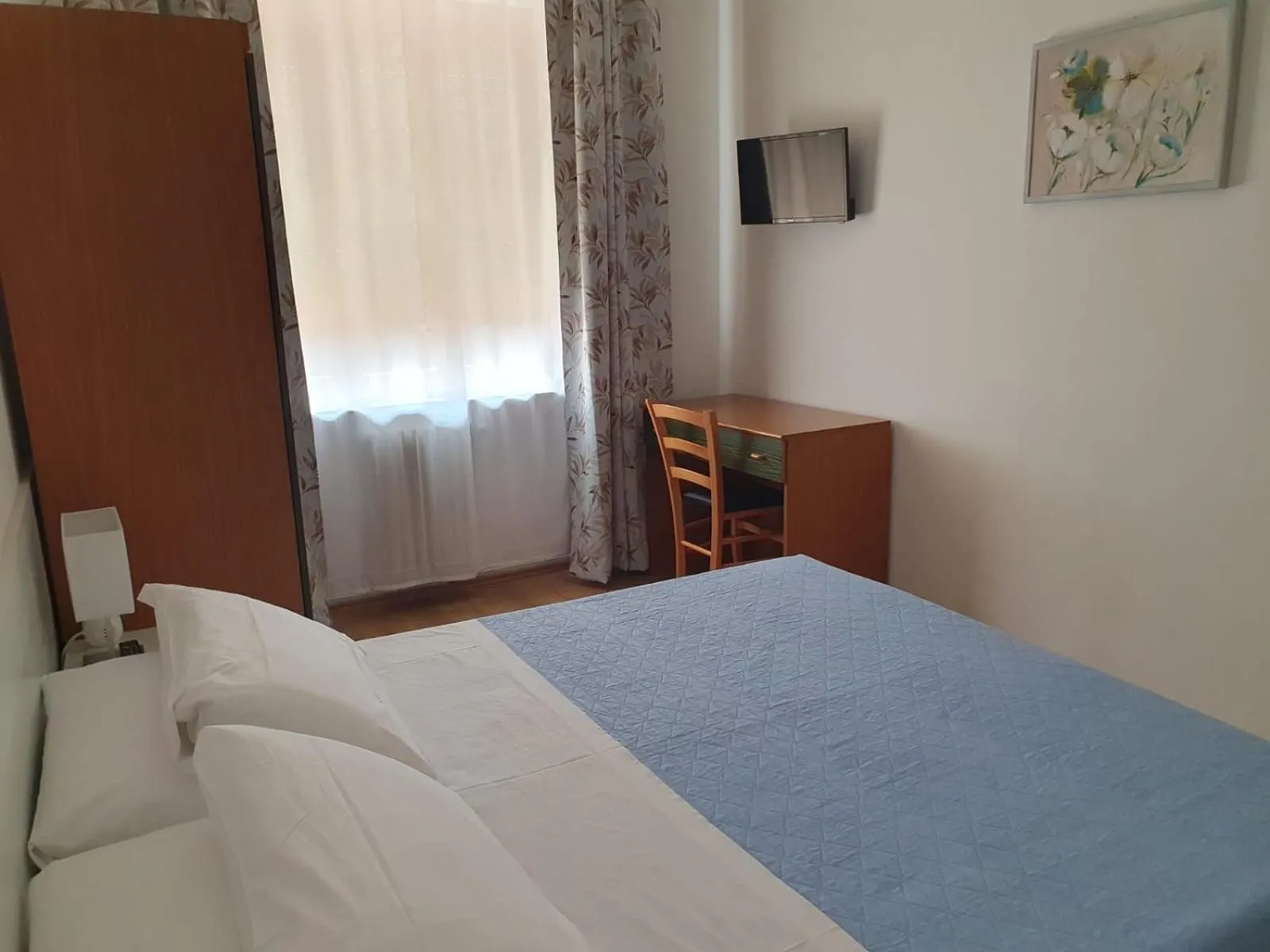 Bed in Hotel Cormorano