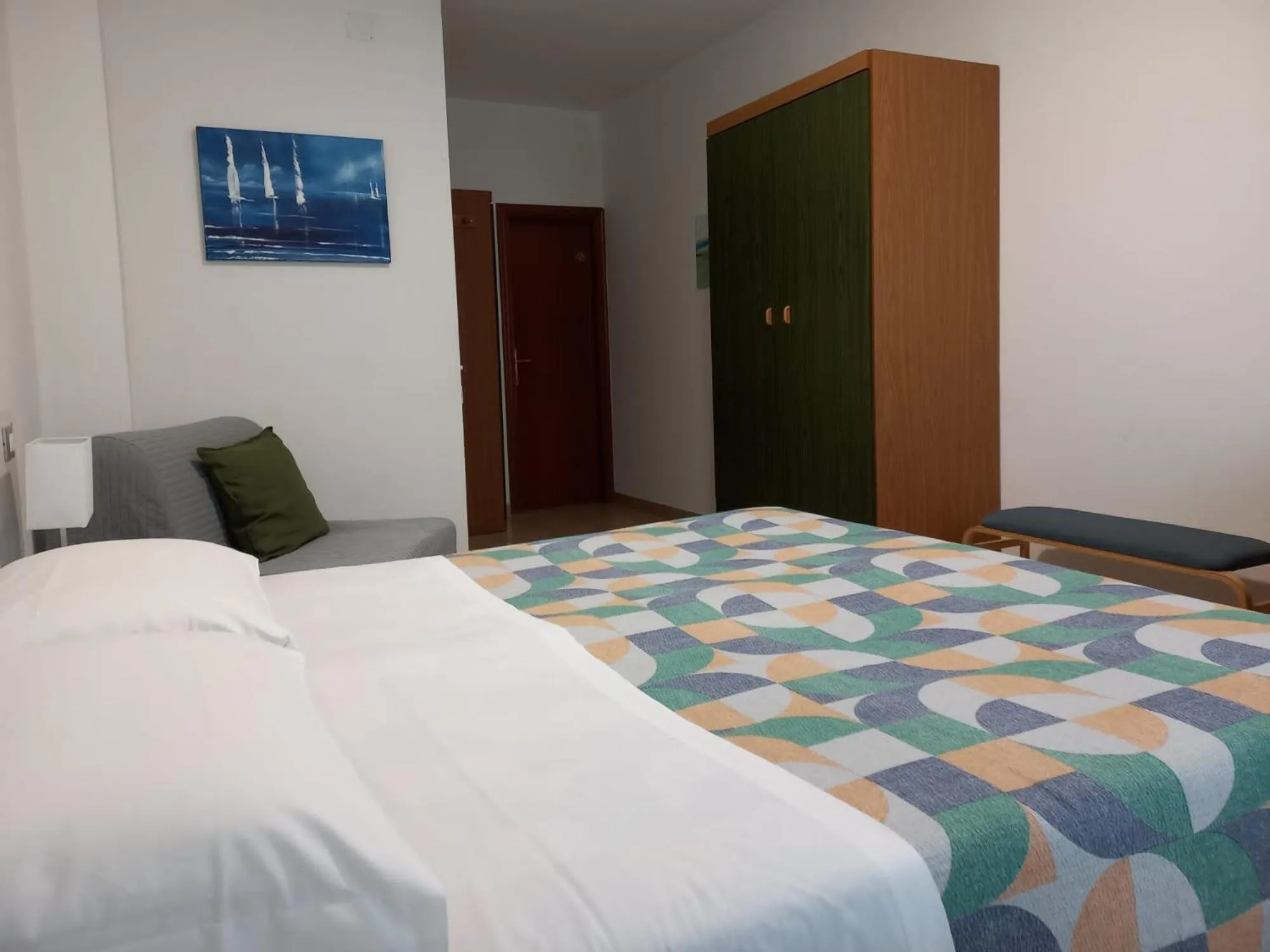 Bed in Hotel Cormorano