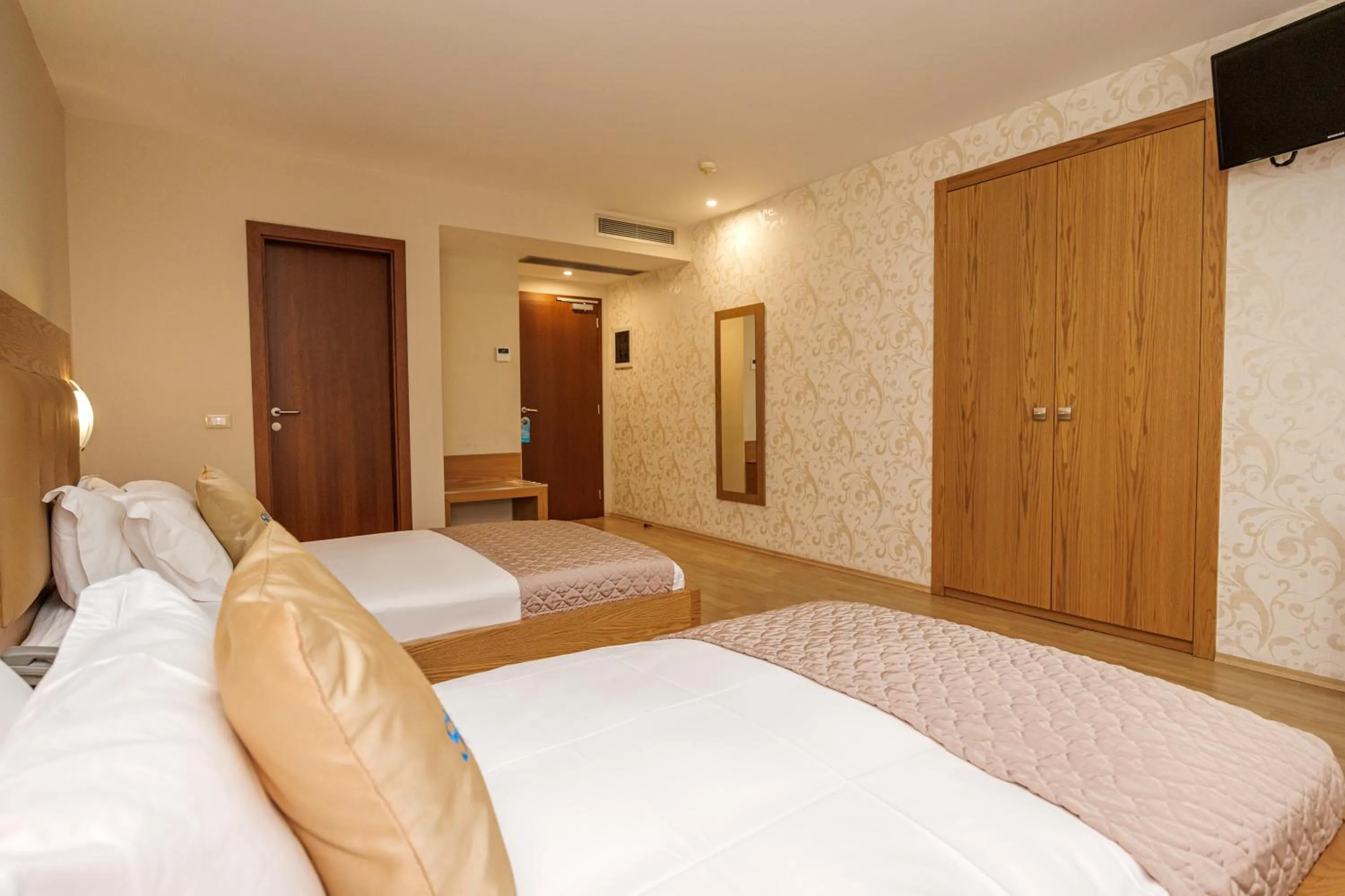 Communal lounge/ TV room, Bed in Sky Hotel Tirana