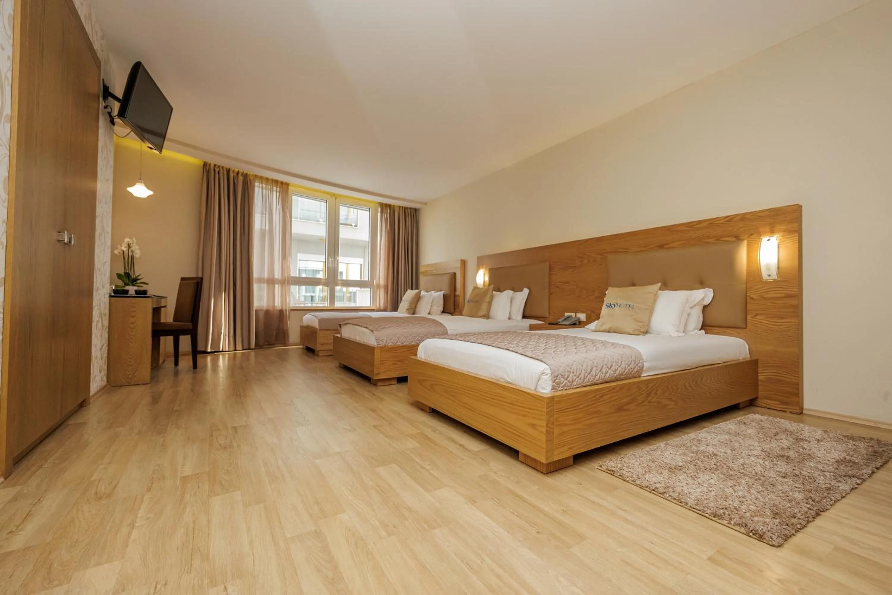 Communal lounge/ TV room, Bed in Sky Hotel Tirana