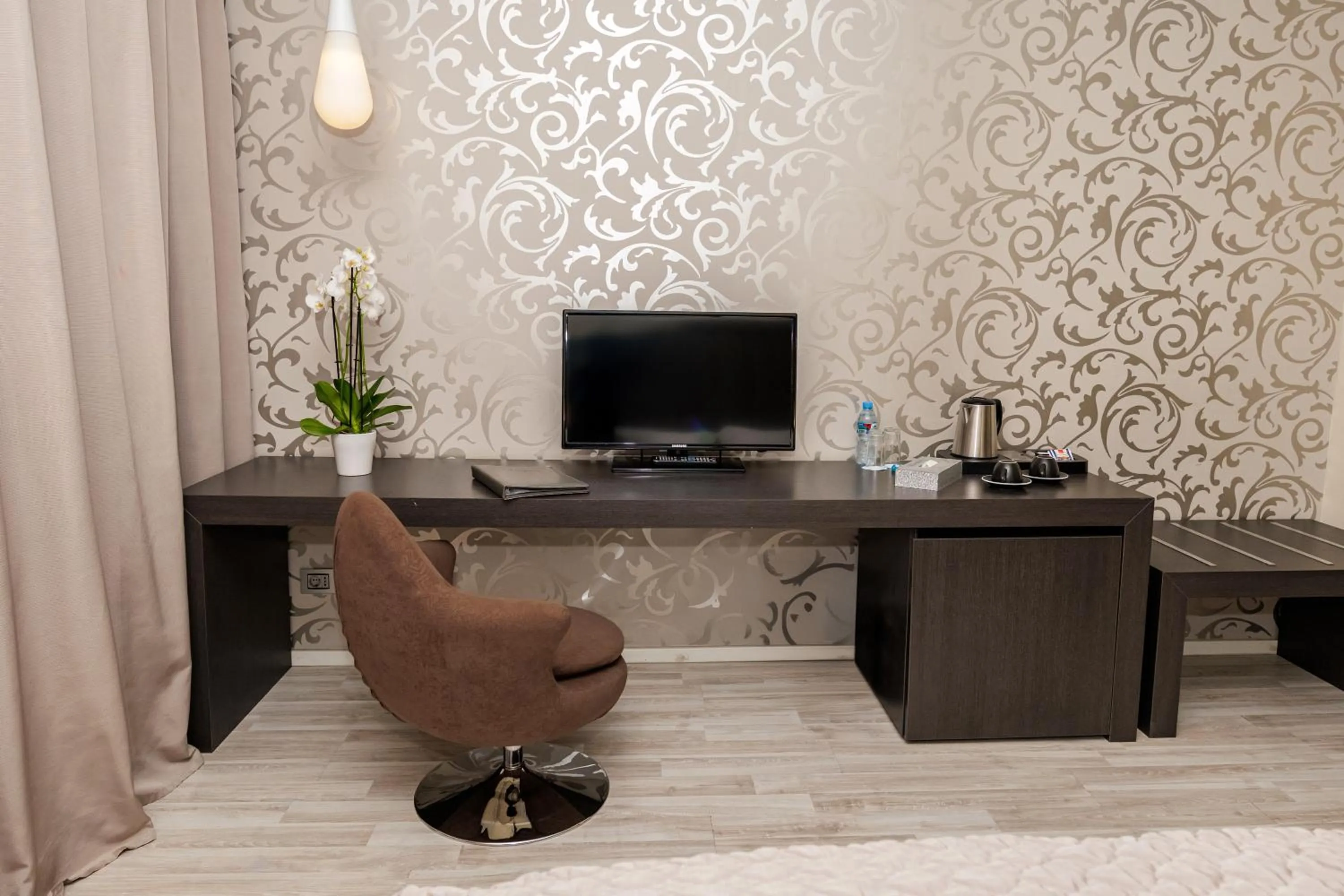 Communal lounge/ TV room in Sky Hotel Tirana