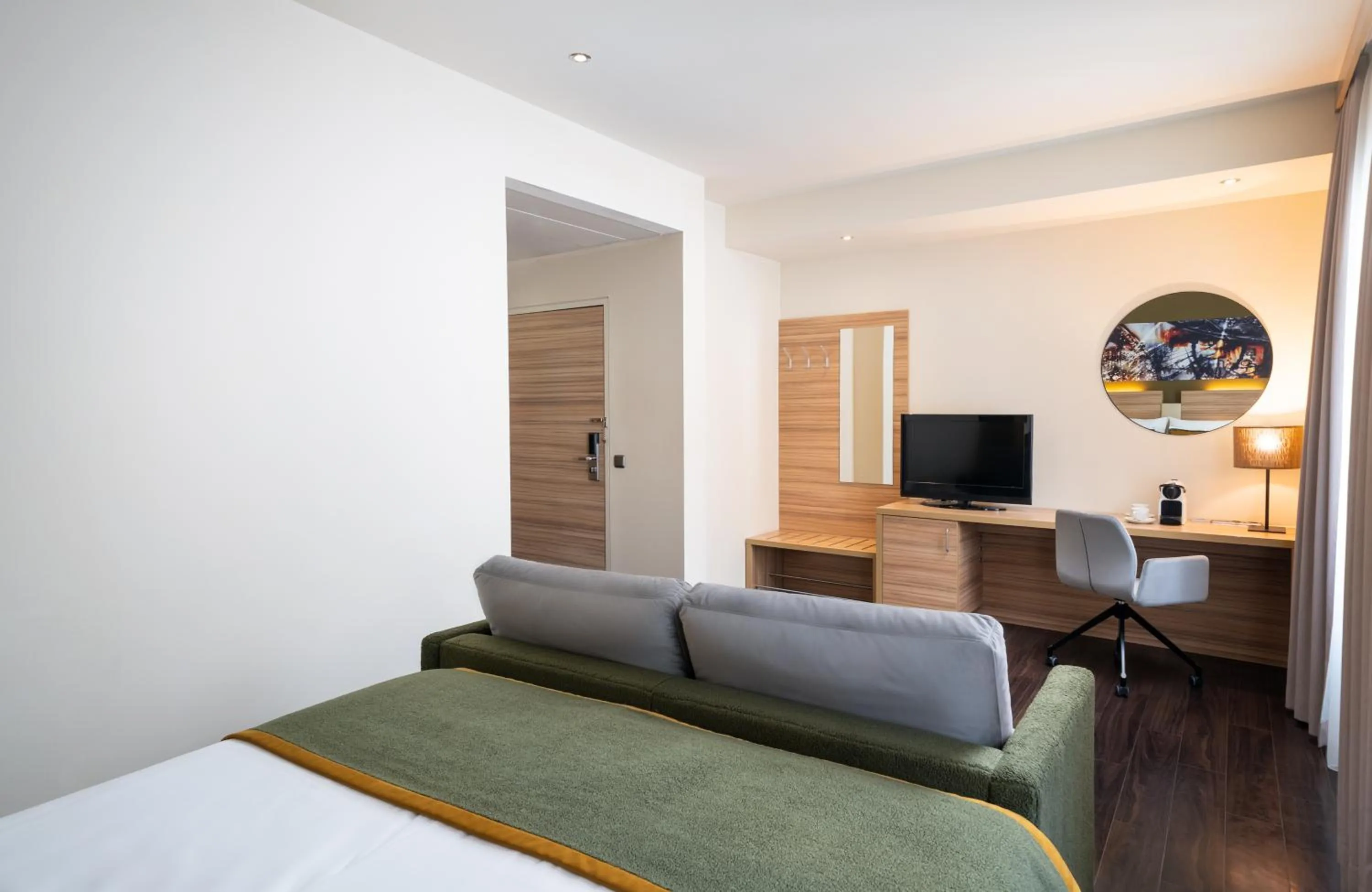 Living room, Bed in Leonardo Boutique Hotel Salzburg Gablerbräu