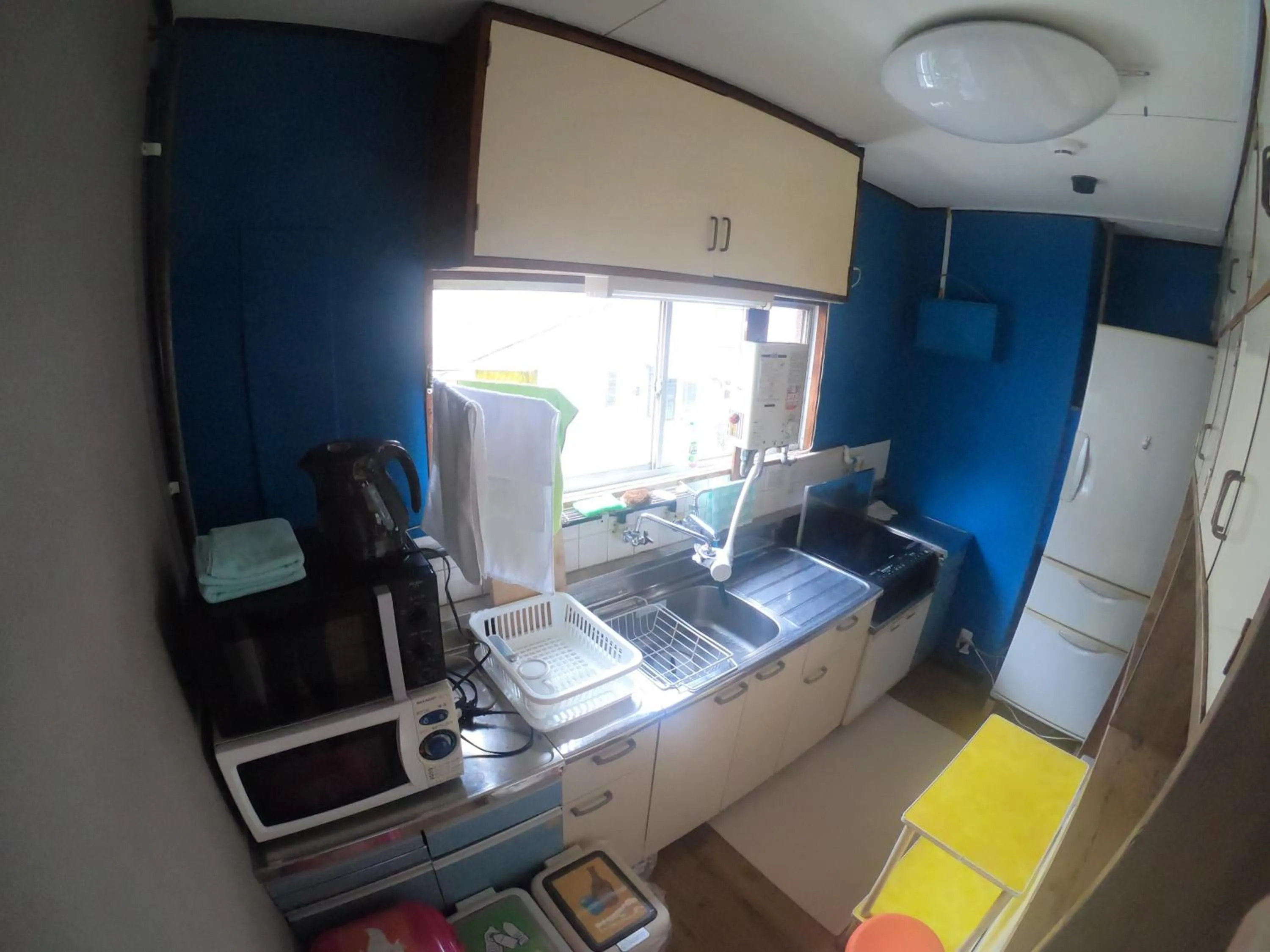 Communal kitchen in GUEST HOUSE SaKURa