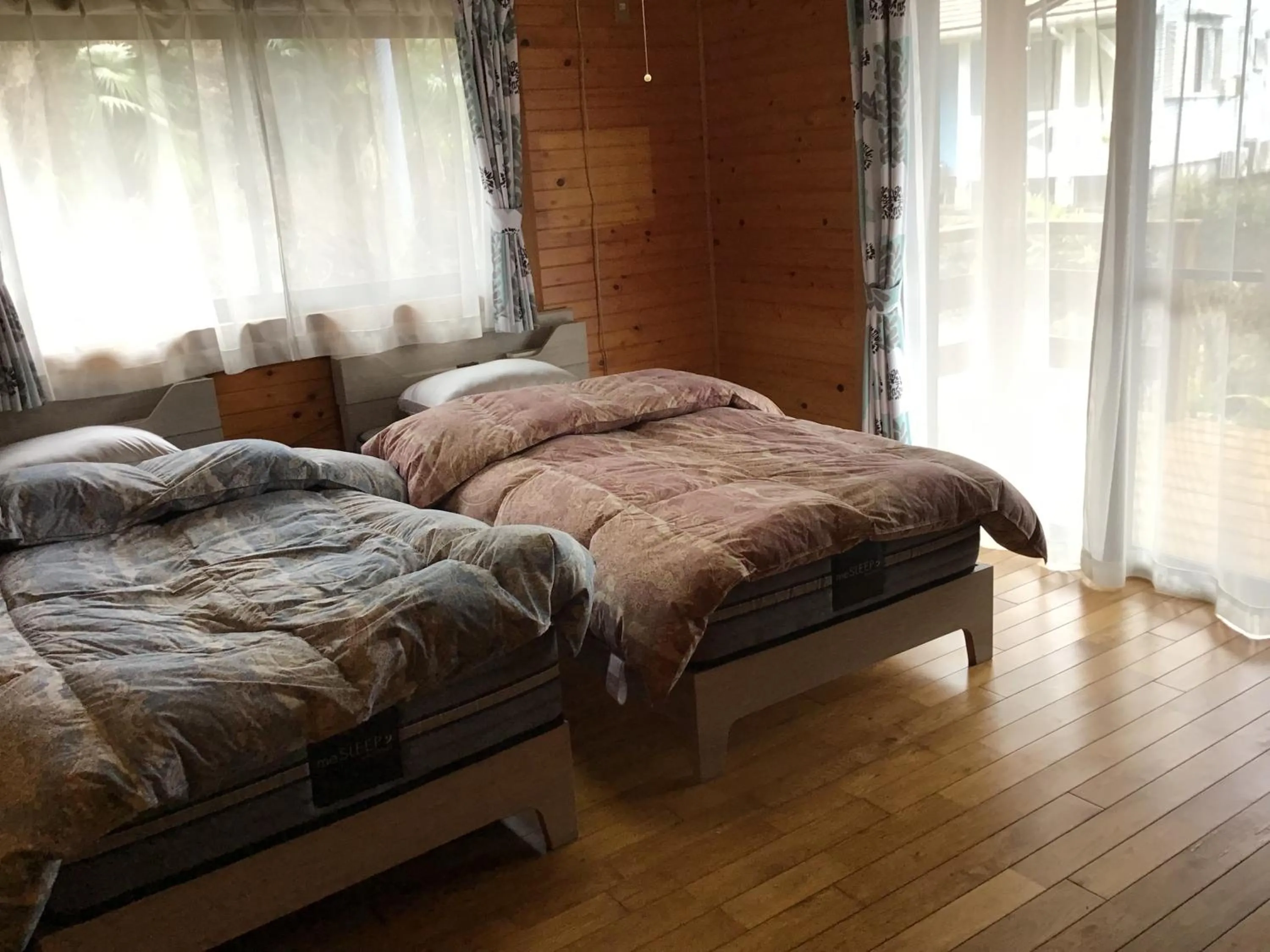 Bed in Yakushima Pension Luana House