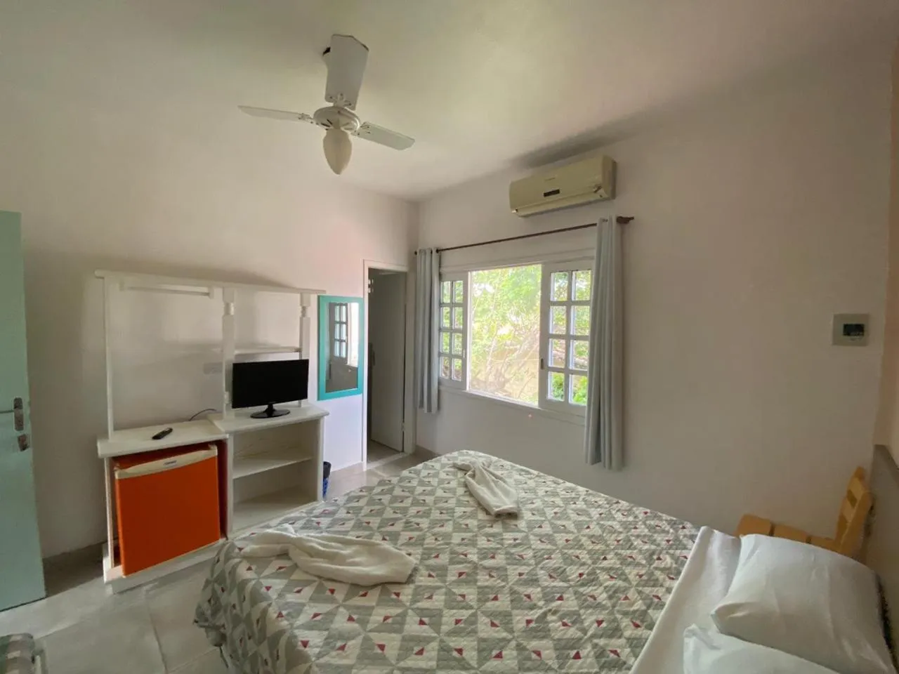 Bed in Pousada Liras da Poesia