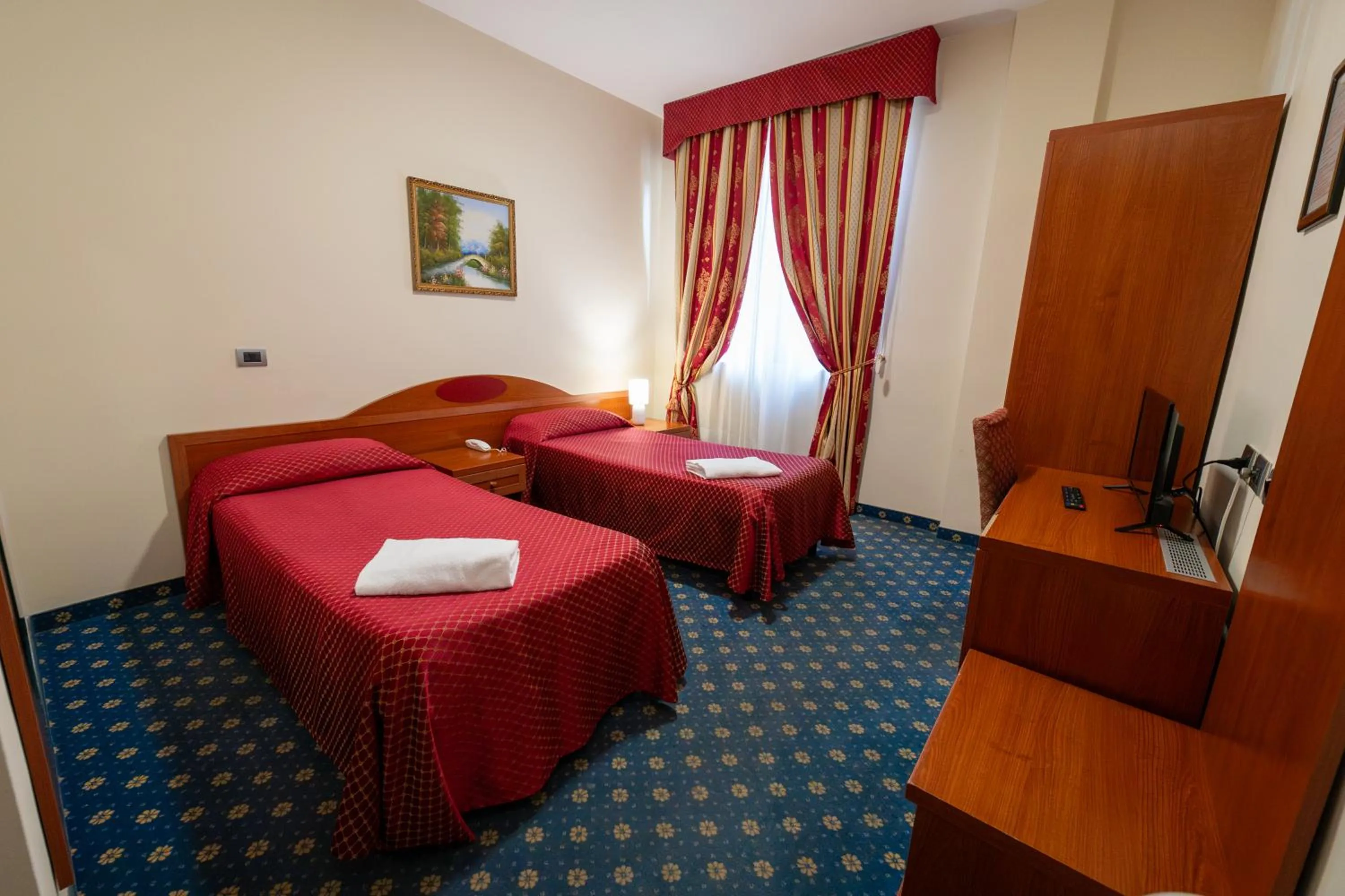 Bed in Hotel Cavour Resort