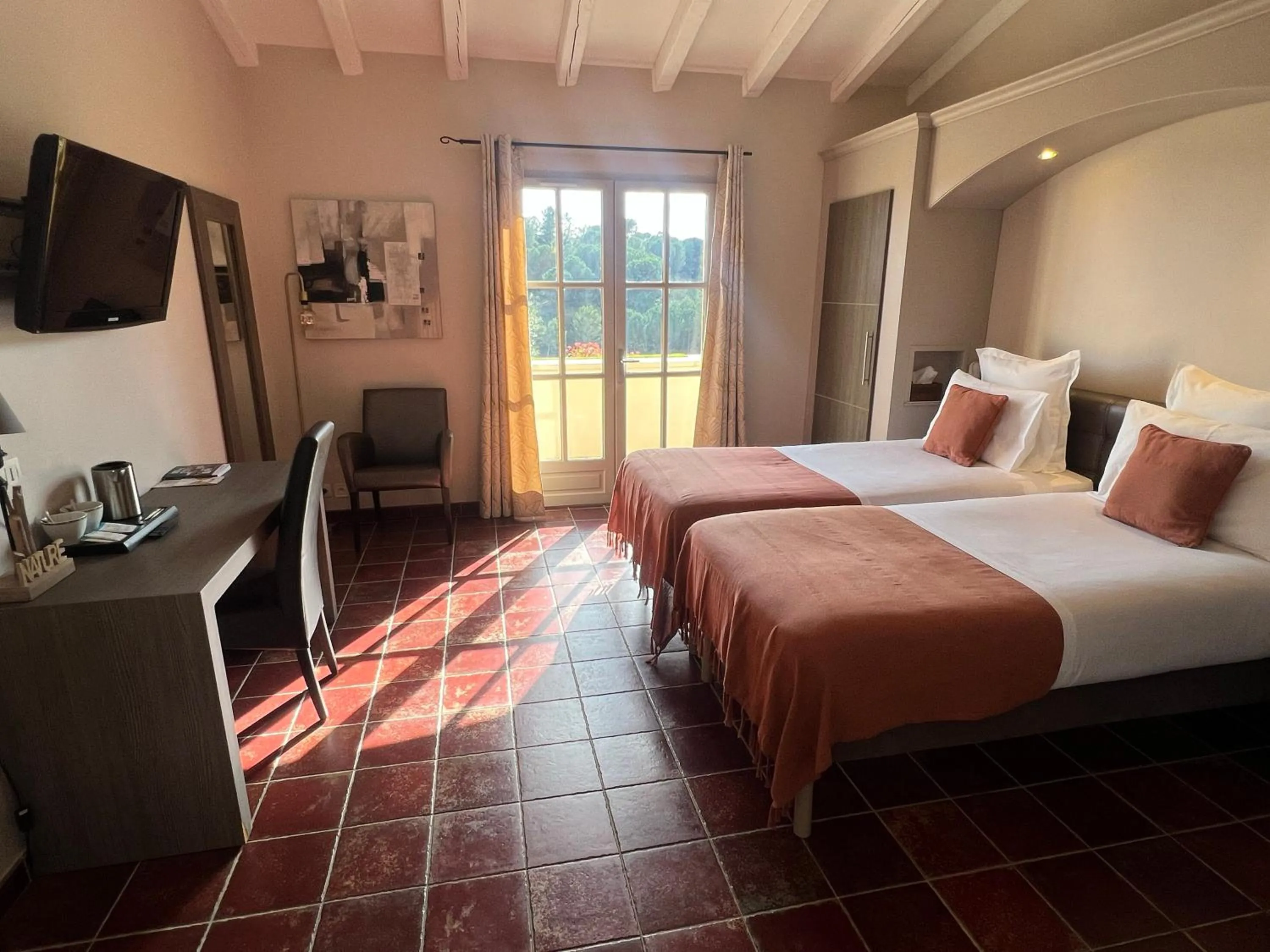 Bed in Logis Hôtel Restaurant La Bergerie