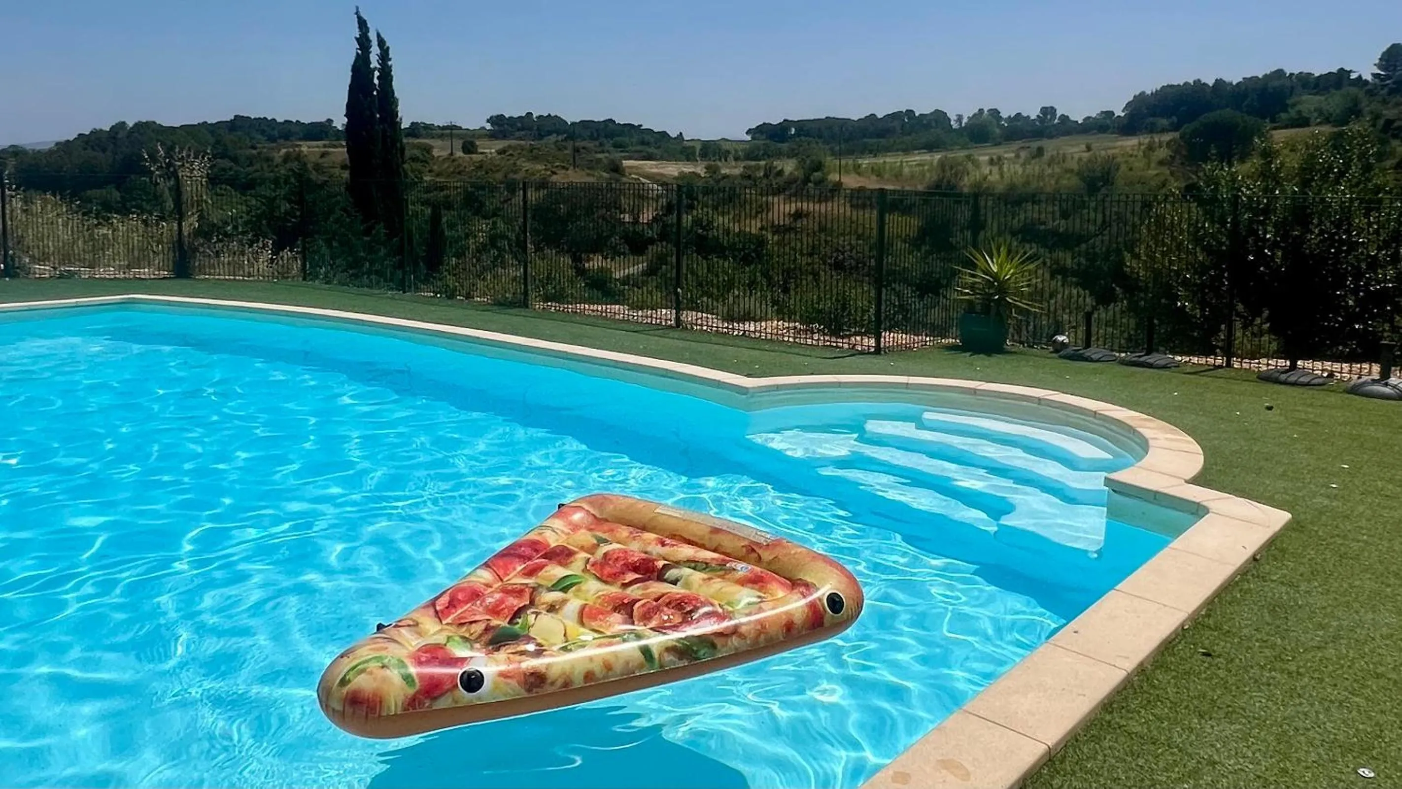 Pool view in Logis Hôtel Restaurant La Bergerie