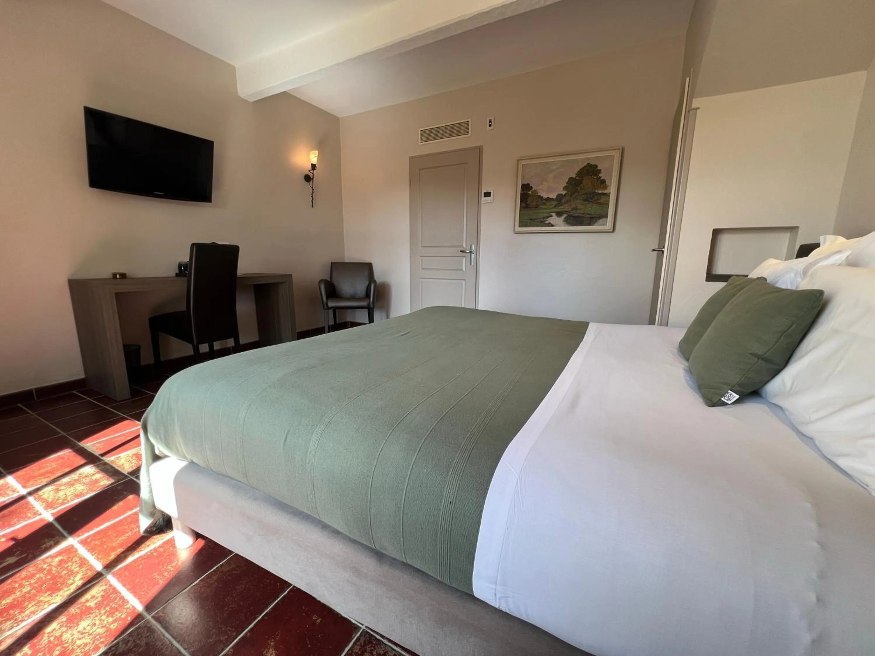 Bed in Logis Hôtel Restaurant La Bergerie