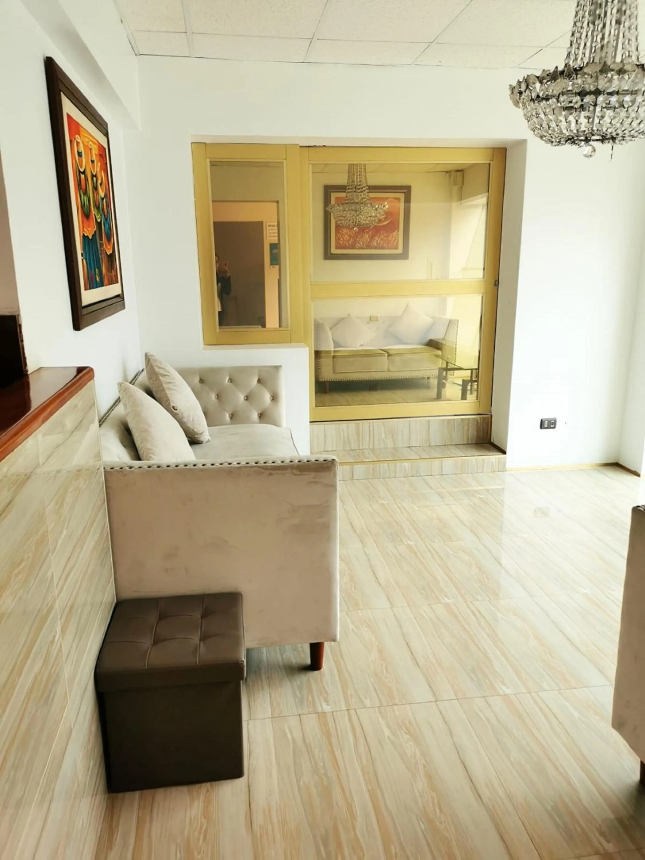 Living room, Bed in Epiqus Hotel