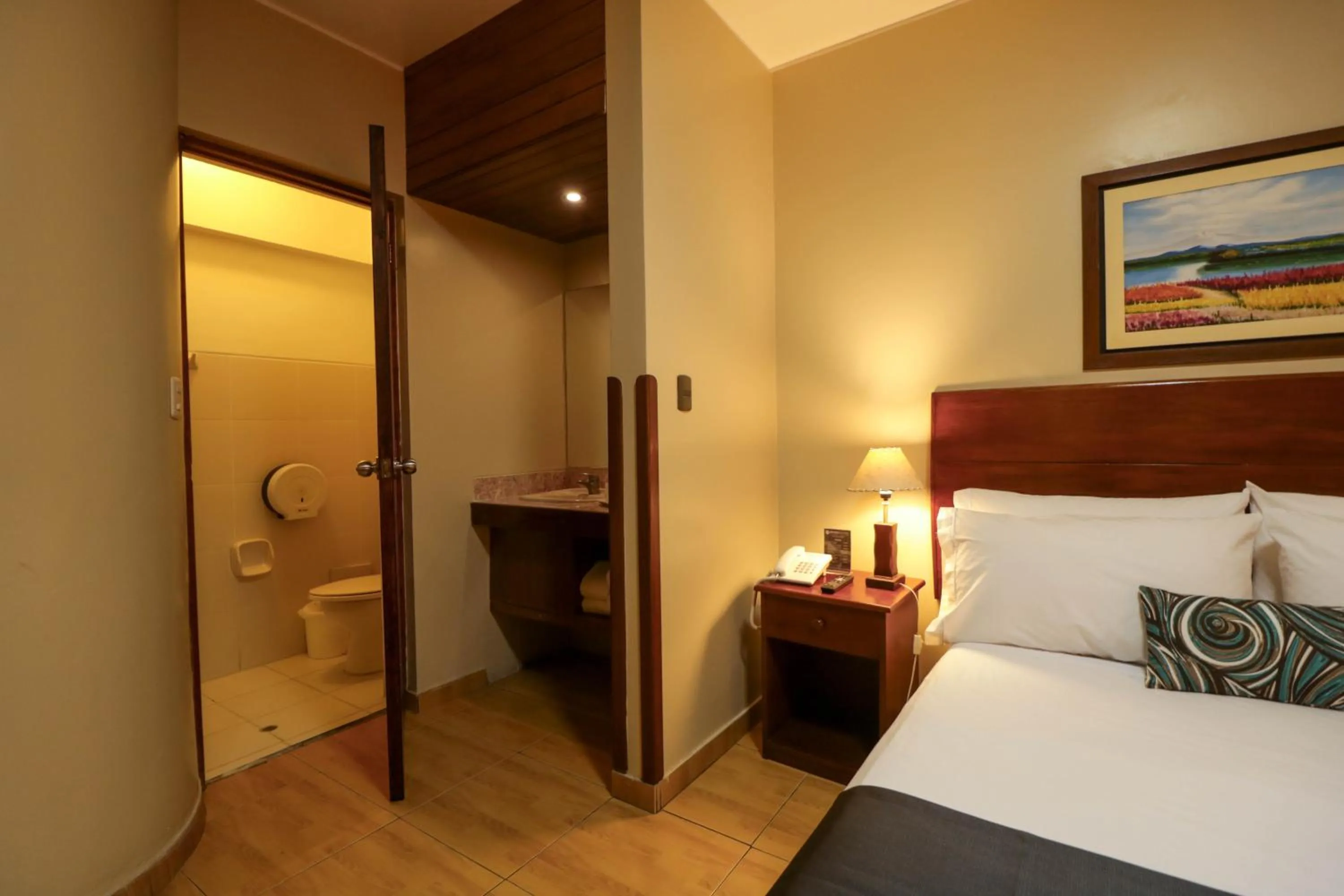 Toilet, Bed in Epiqus Hotel