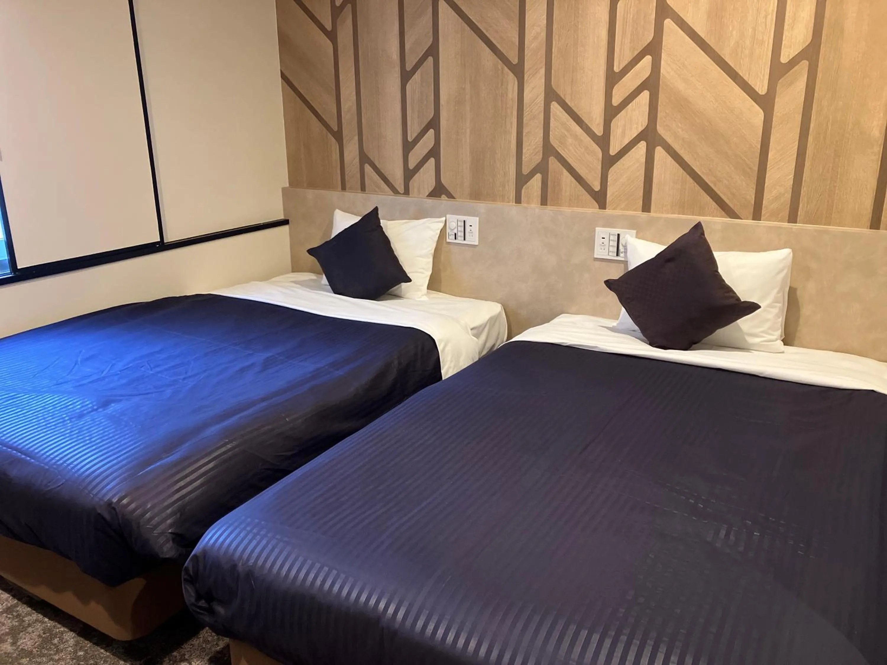 Bed in HOTEL LiVEMAX BUDGET Naha