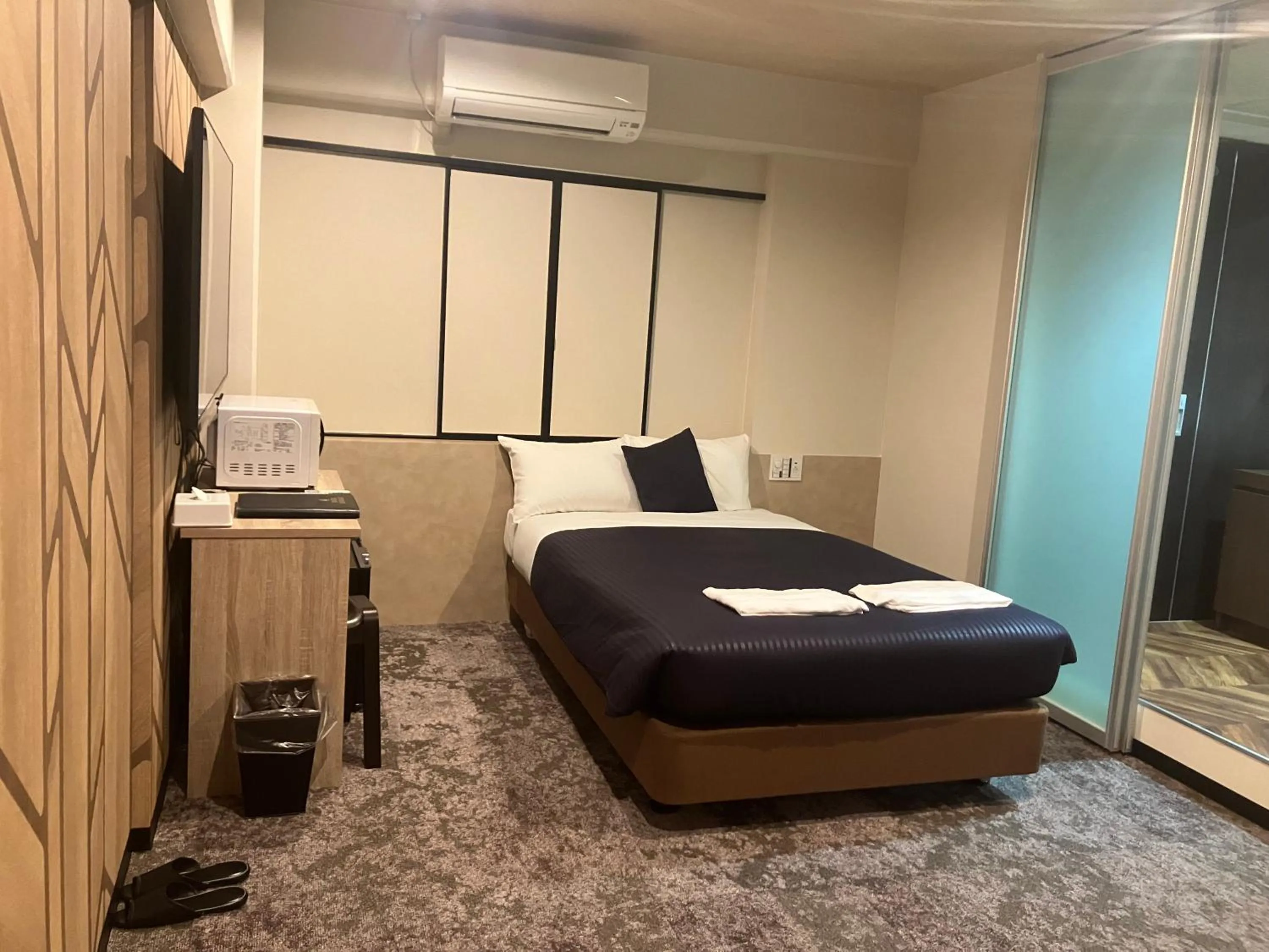 Bed in HOTEL LiVEMAX BUDGET Naha