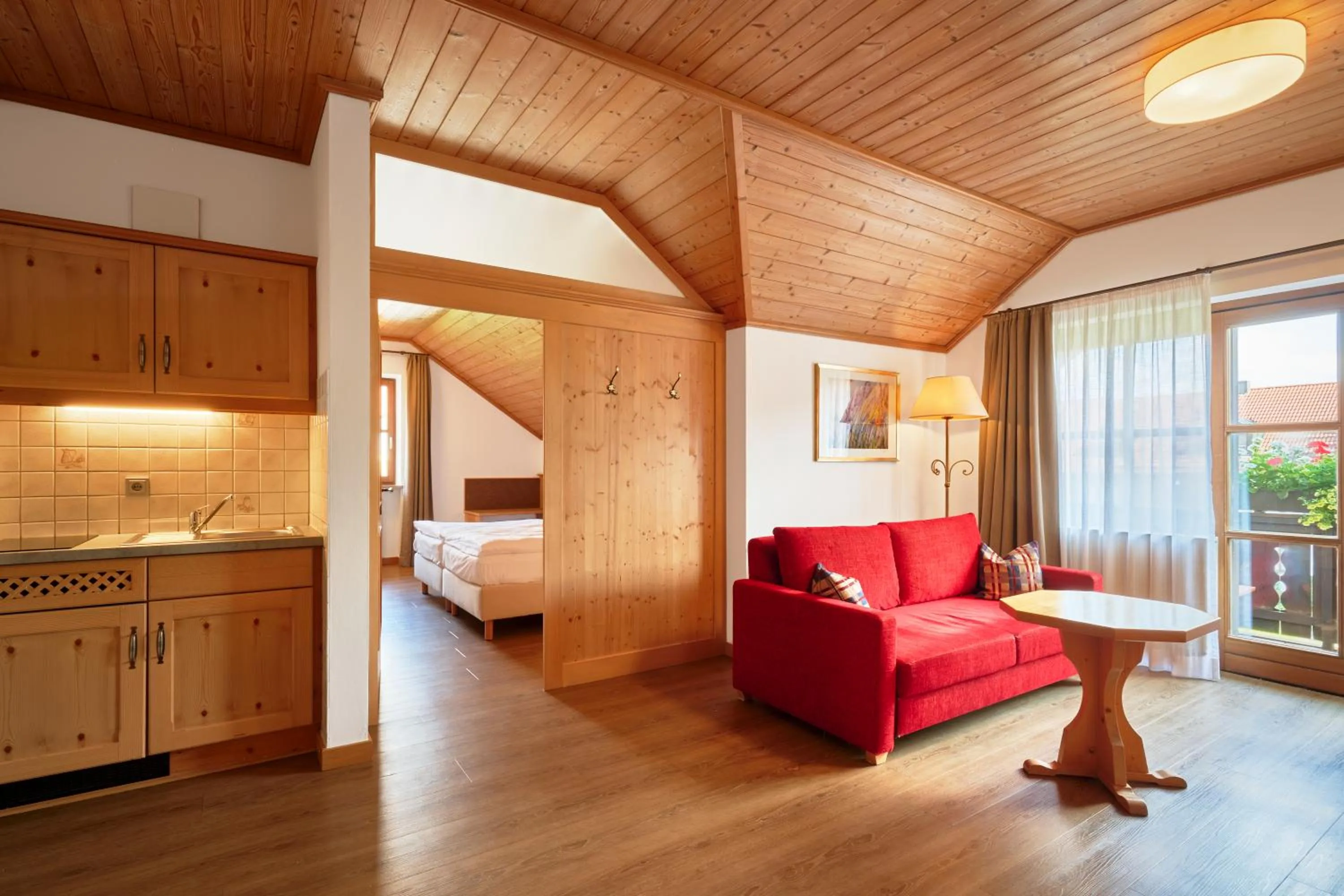 Living room, Bed in Glasl's Landhotel