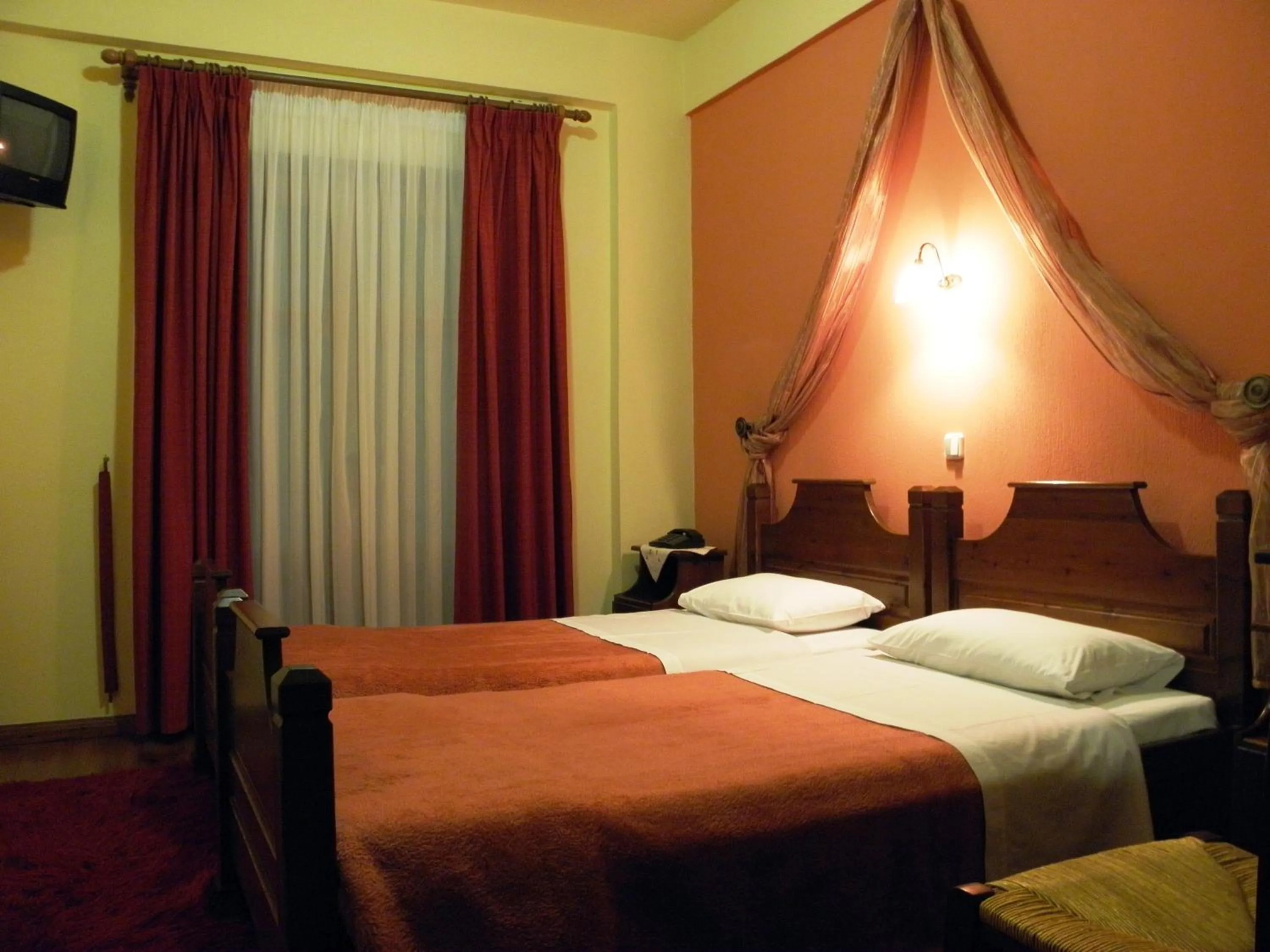 Bed in Hotel Mpakou