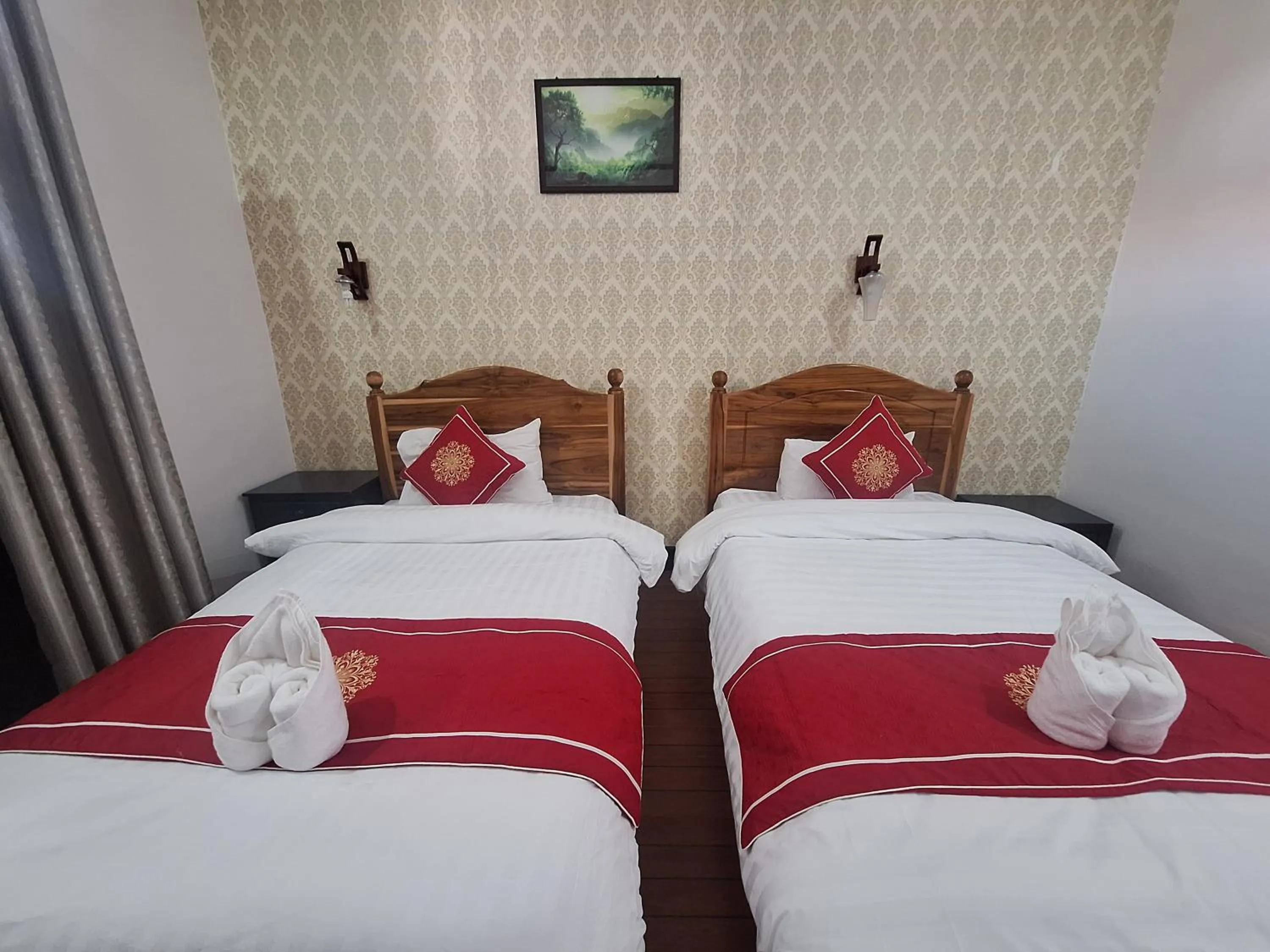 Bed in Luang Prabang Pavilion Hotel & Travel