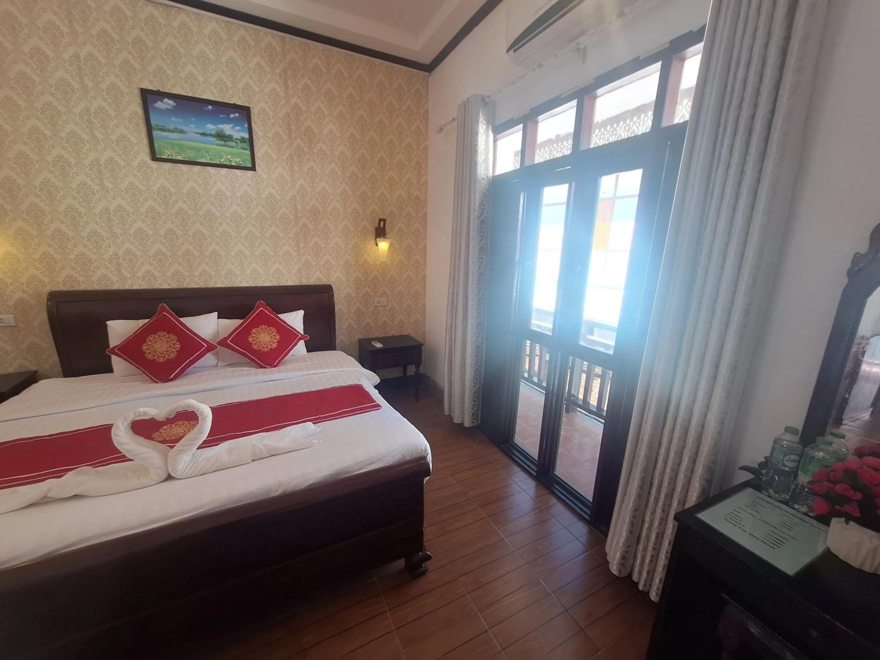 Bed in Luang Prabang Pavilion Hotel & Travel