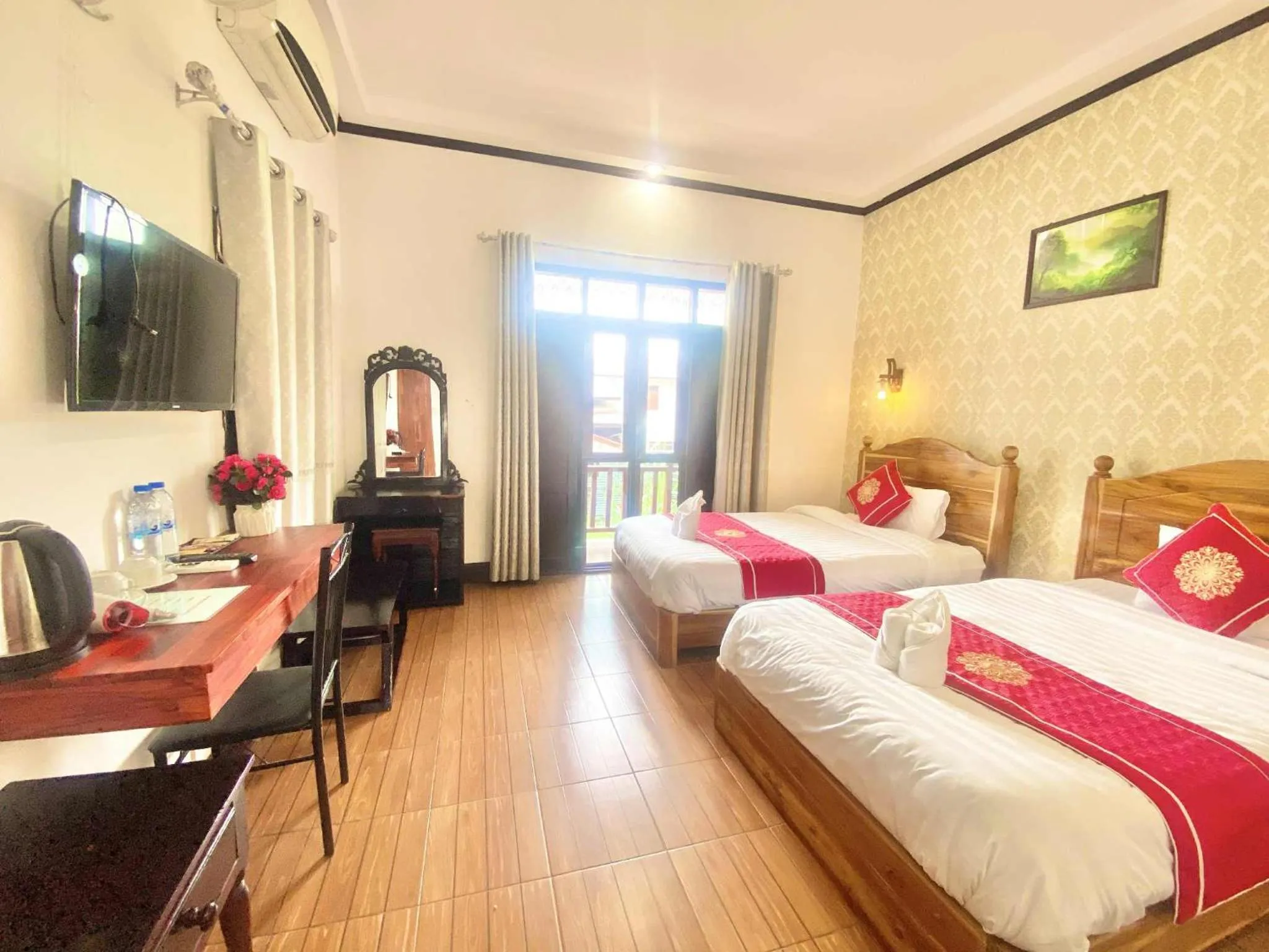 Bed in Luang Prabang Pavilion Hotel & Travel